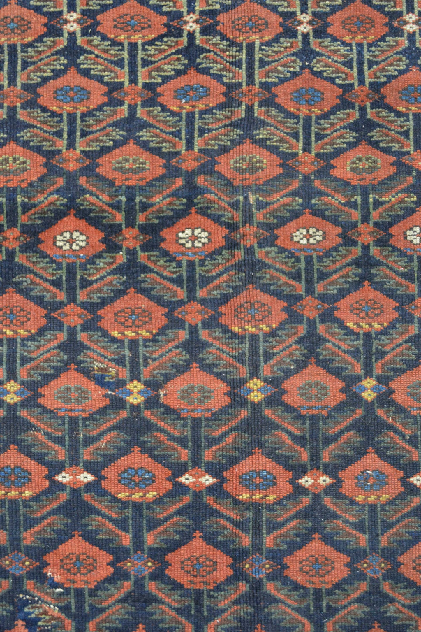 The center's close up shows blue background with a red roses pattern. Inside every rose there are nested mini flowers as well.