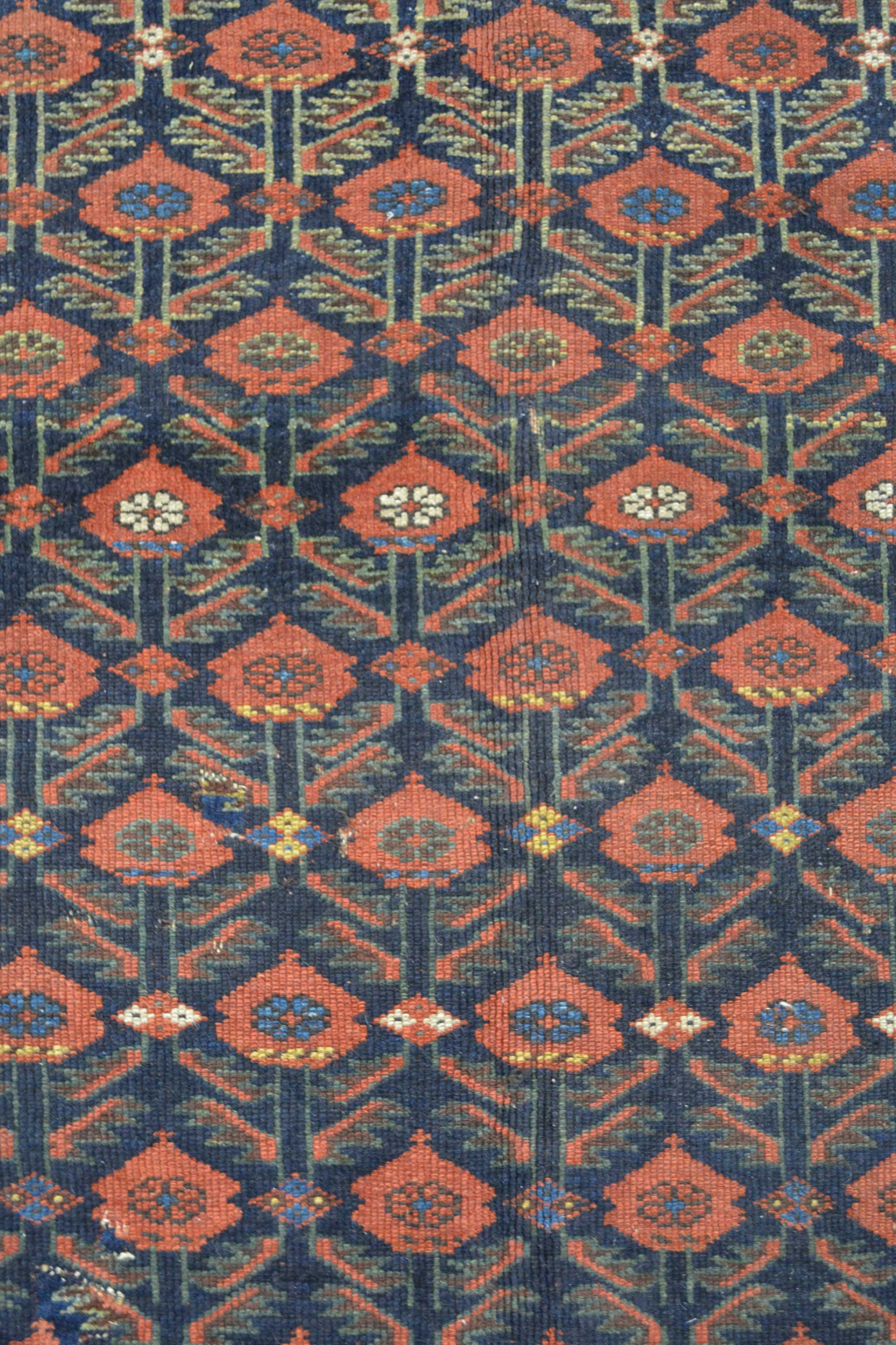 The center's close up shows blue background with a red roses pattern. Inside every rose there are nested mini flowers as well.