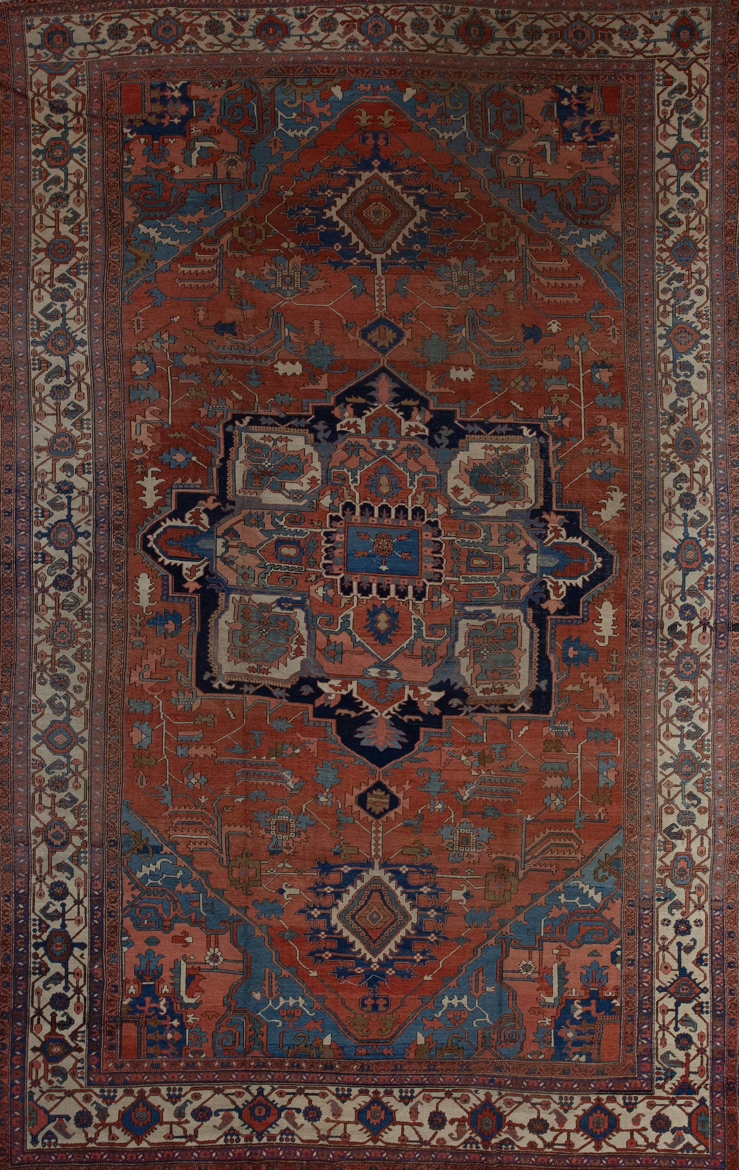 Antique carpet has a brown background which is the dominant color, and the center features an interesting artwork which creates an eight points star. 