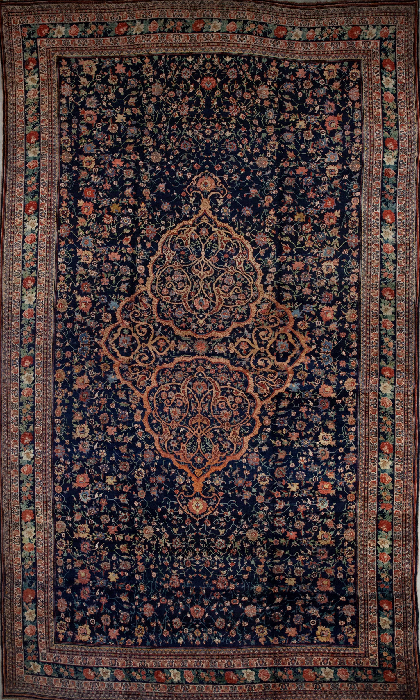 Monumental rug comes with the traditional multiple borders and frames from the antique style. The color palette has red, green, yellow, white, and blue as the dominant tone.