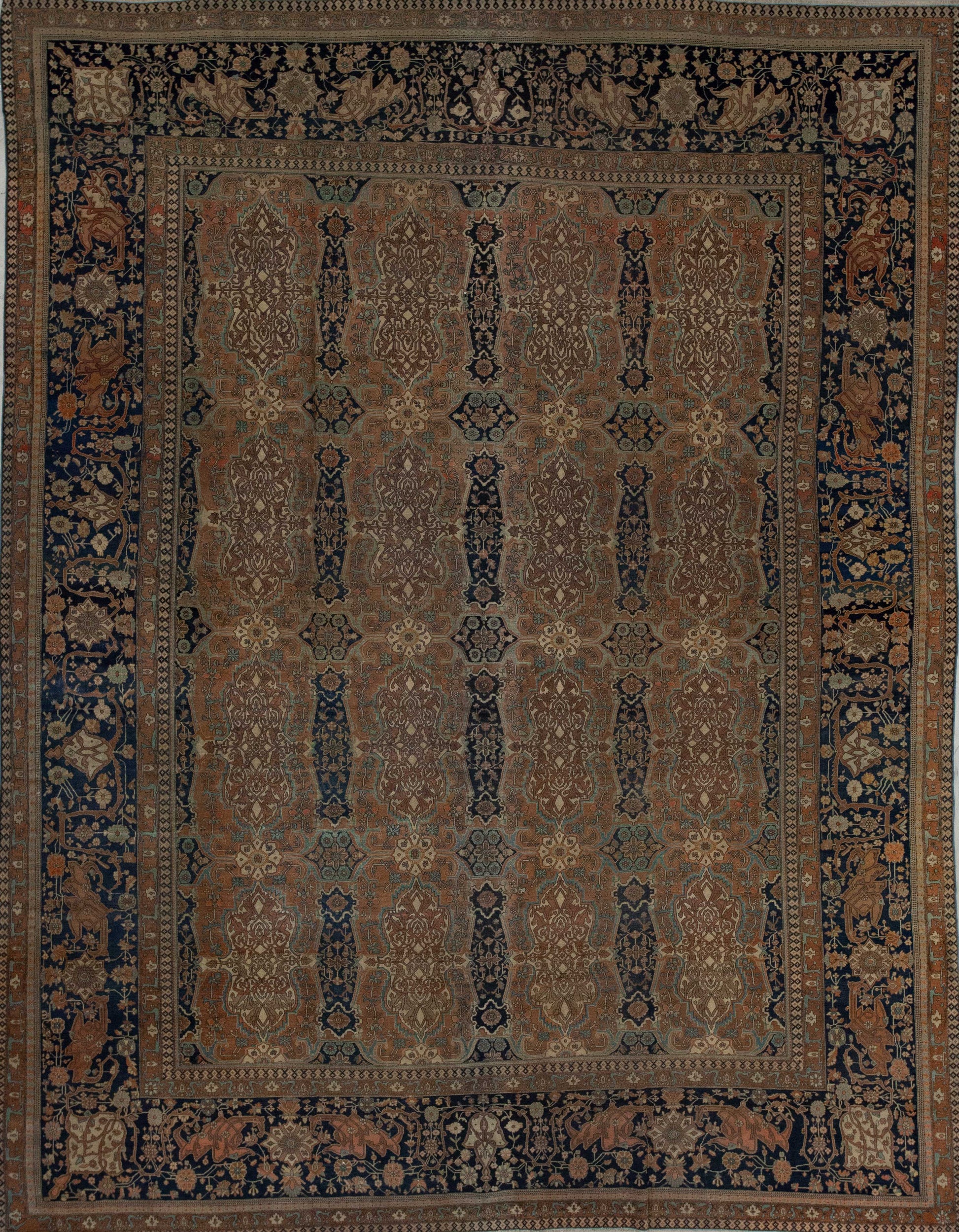 Old fashioned rug with a brown dominant color and dark blue details.