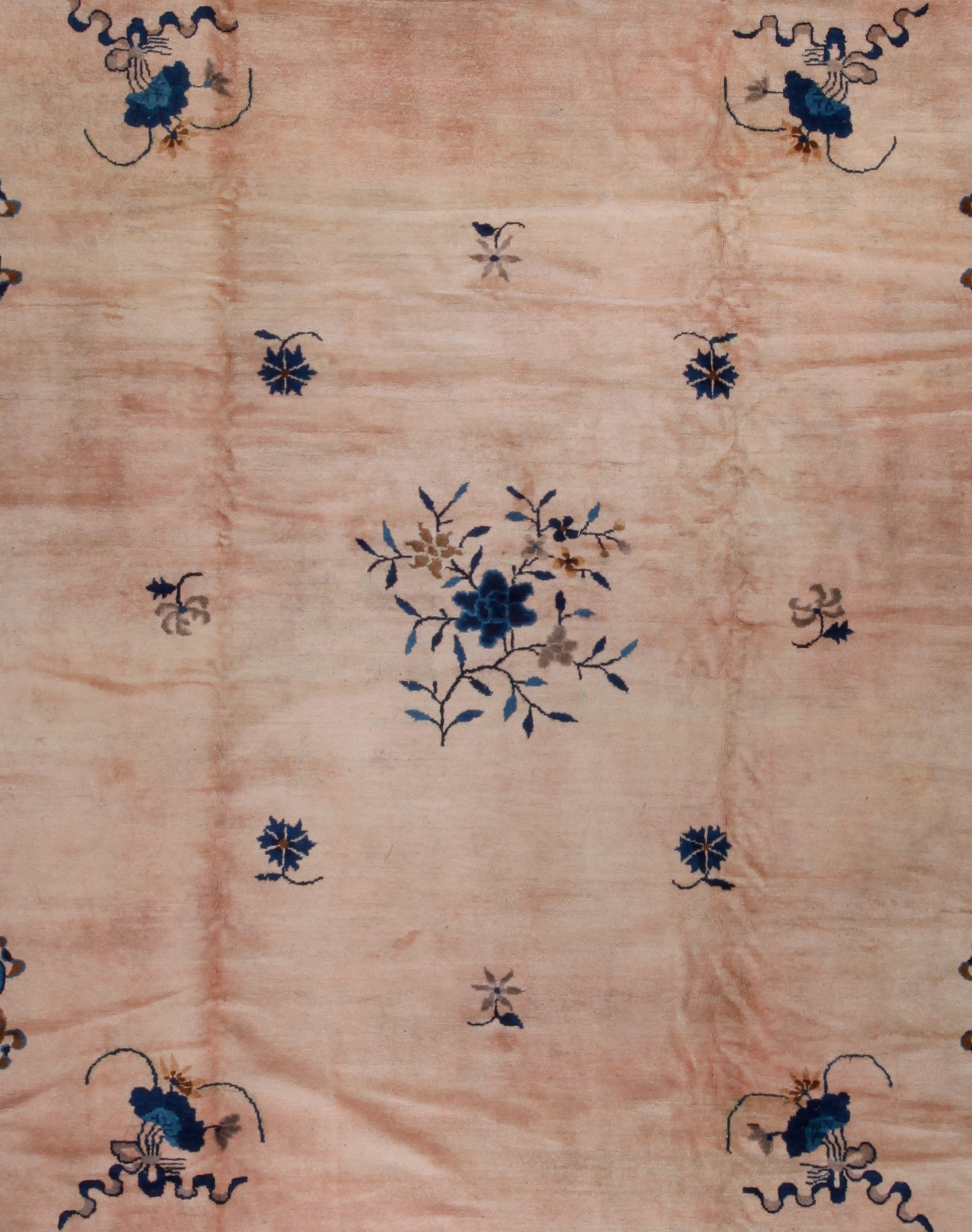 The center shows a small, pretty, and blue flower surrounded by branches and leafs.