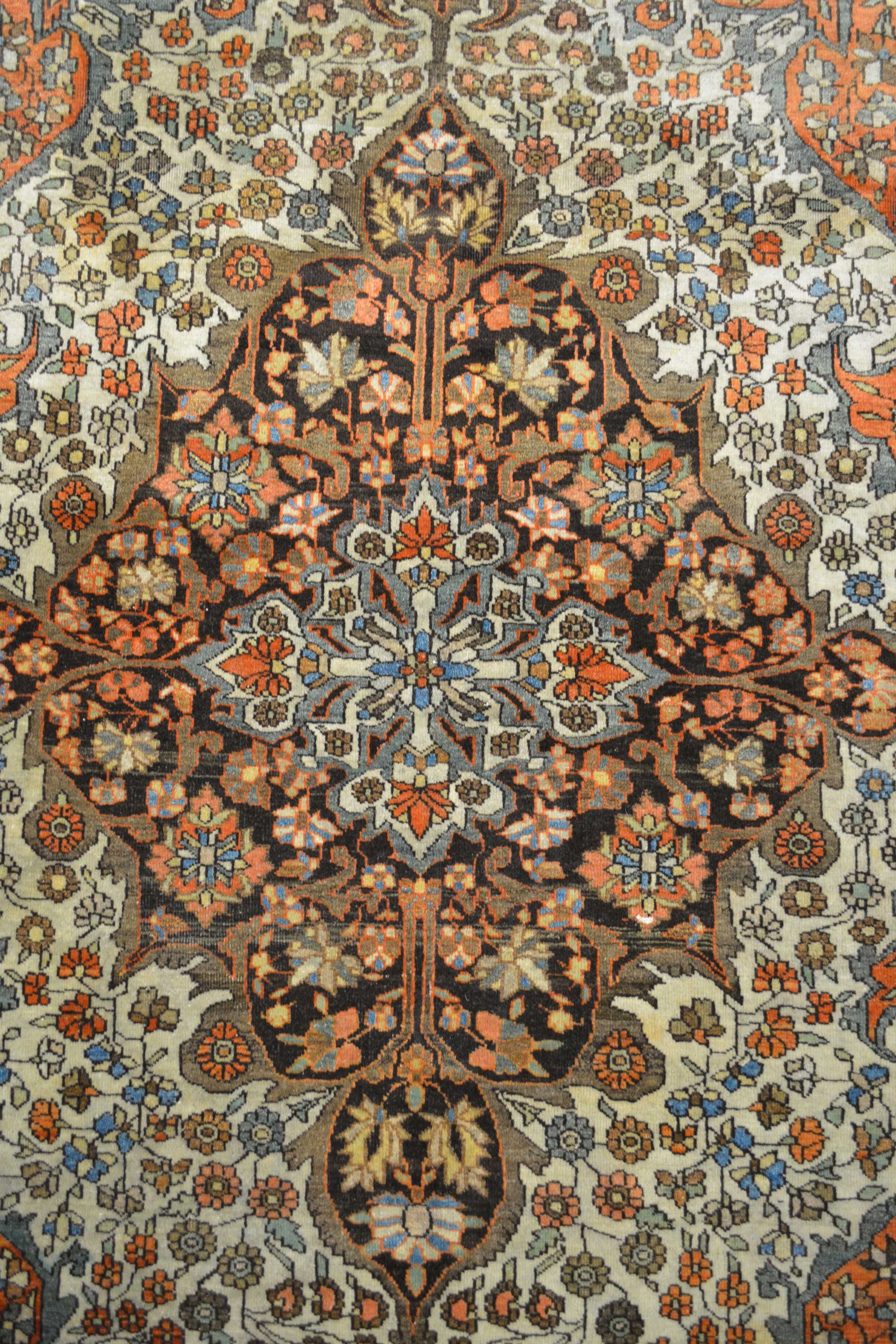 The center's close up shows white background with a big black ornament in the middle full of flowers of different colors.