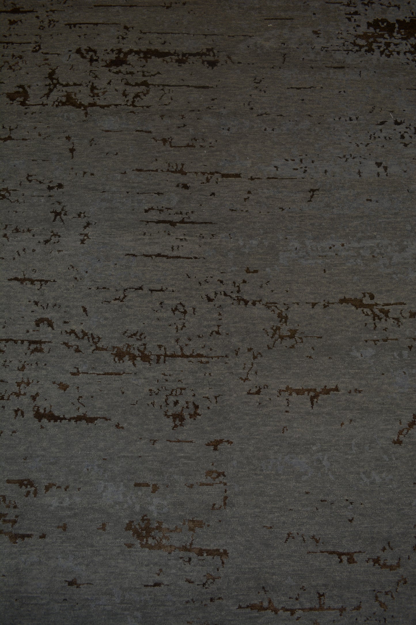 The center's close-up renders the texturized dark gray background with a few brown accents.