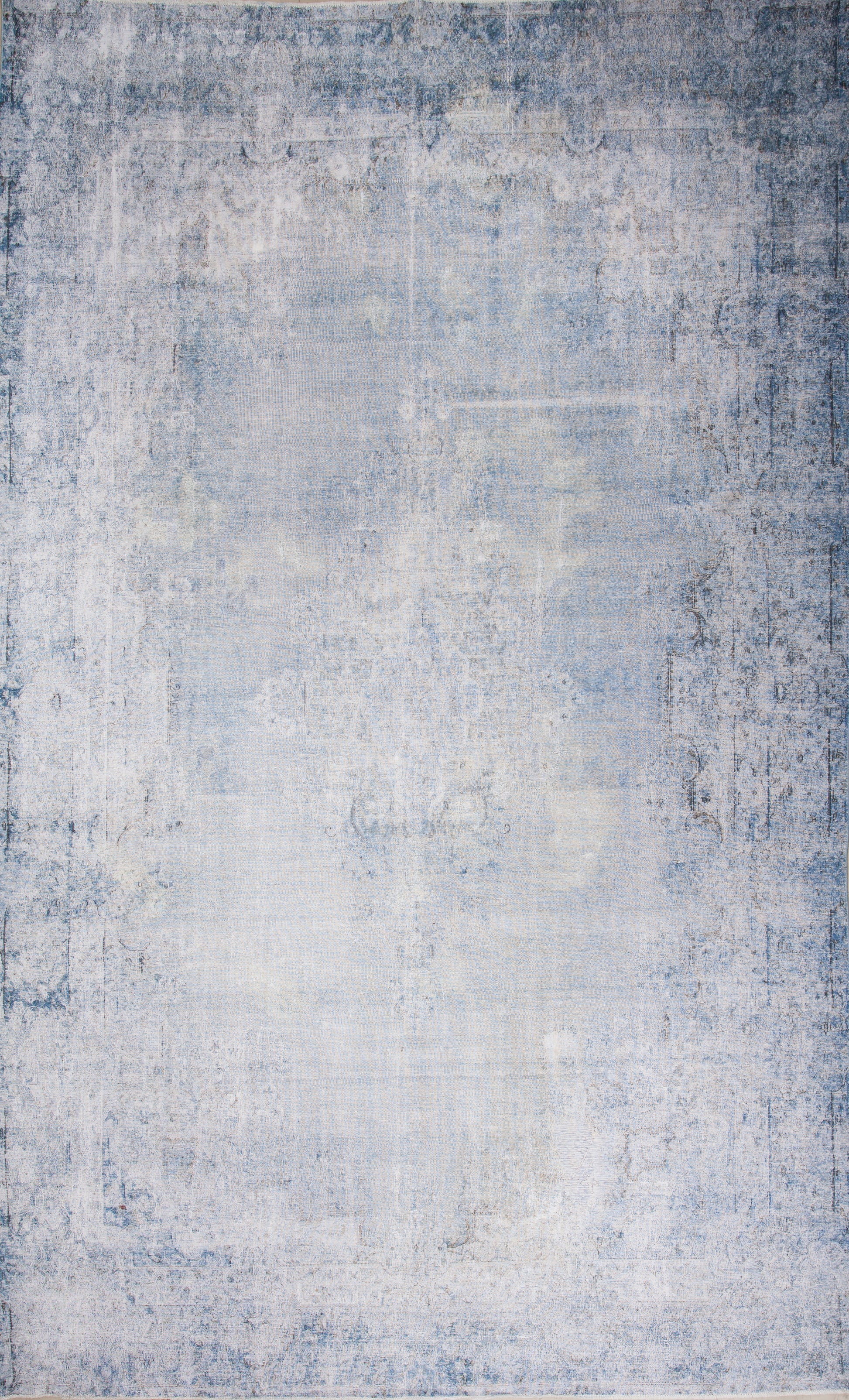 Vintage rug within white throughout navy blue in a distressed finish.