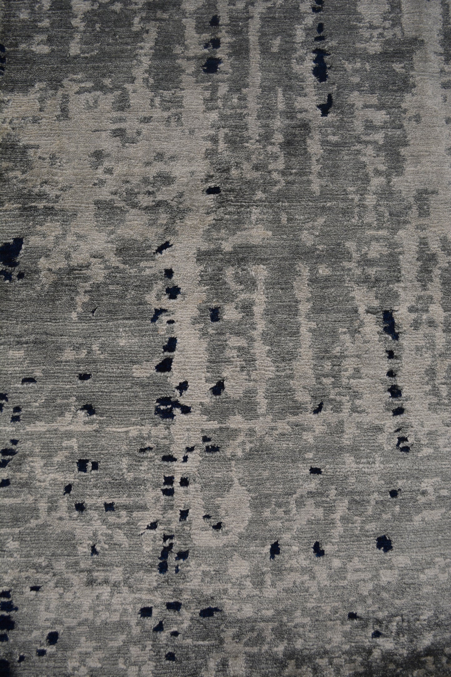 On the bottom left corner, the vertical gray distressed pattern dominates the portion.