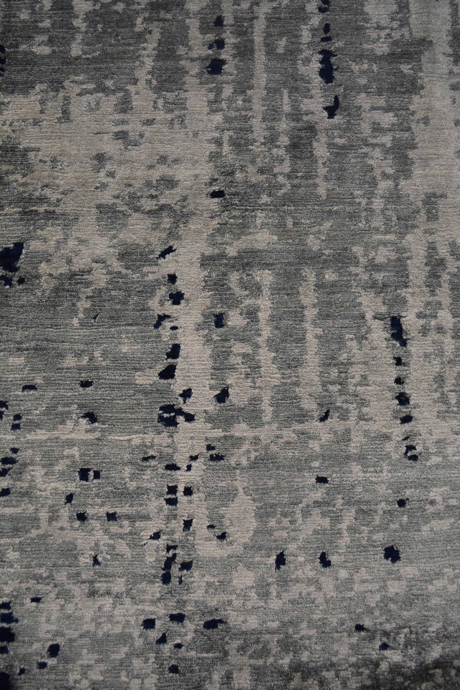 On the bottom left corner, the vertical gray distressed pattern dominates the portion.