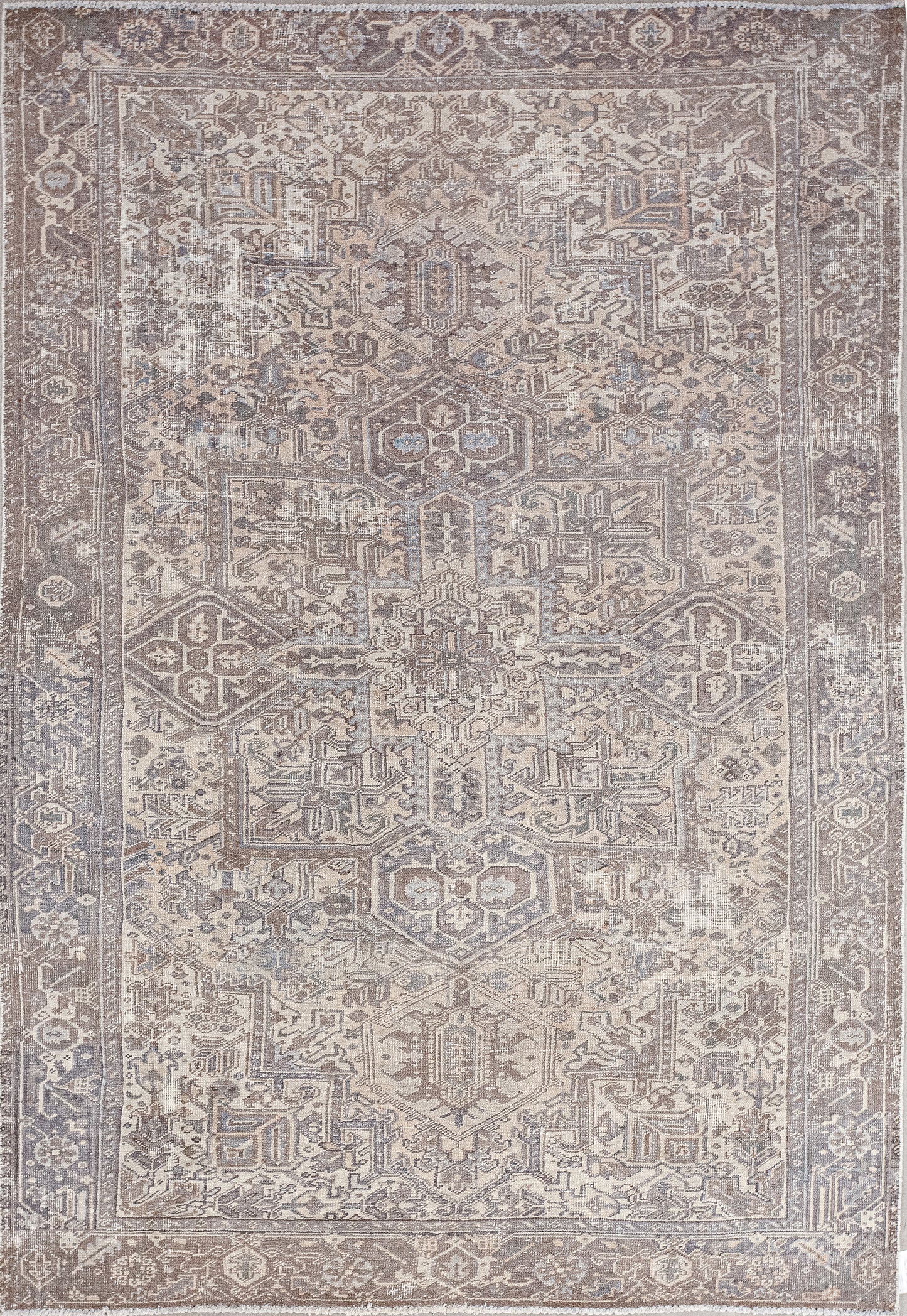 A strange carpet was woven with the decoration of a tribal temple. The color palette of the wood has variations of brown and some reflections of gray.