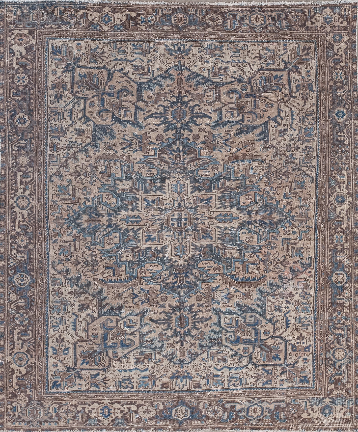 This astounding carpet was woven with a cool spiky tribal design. The color scheme was inspired by the land and ocean because it comes in variations of brown and blue.