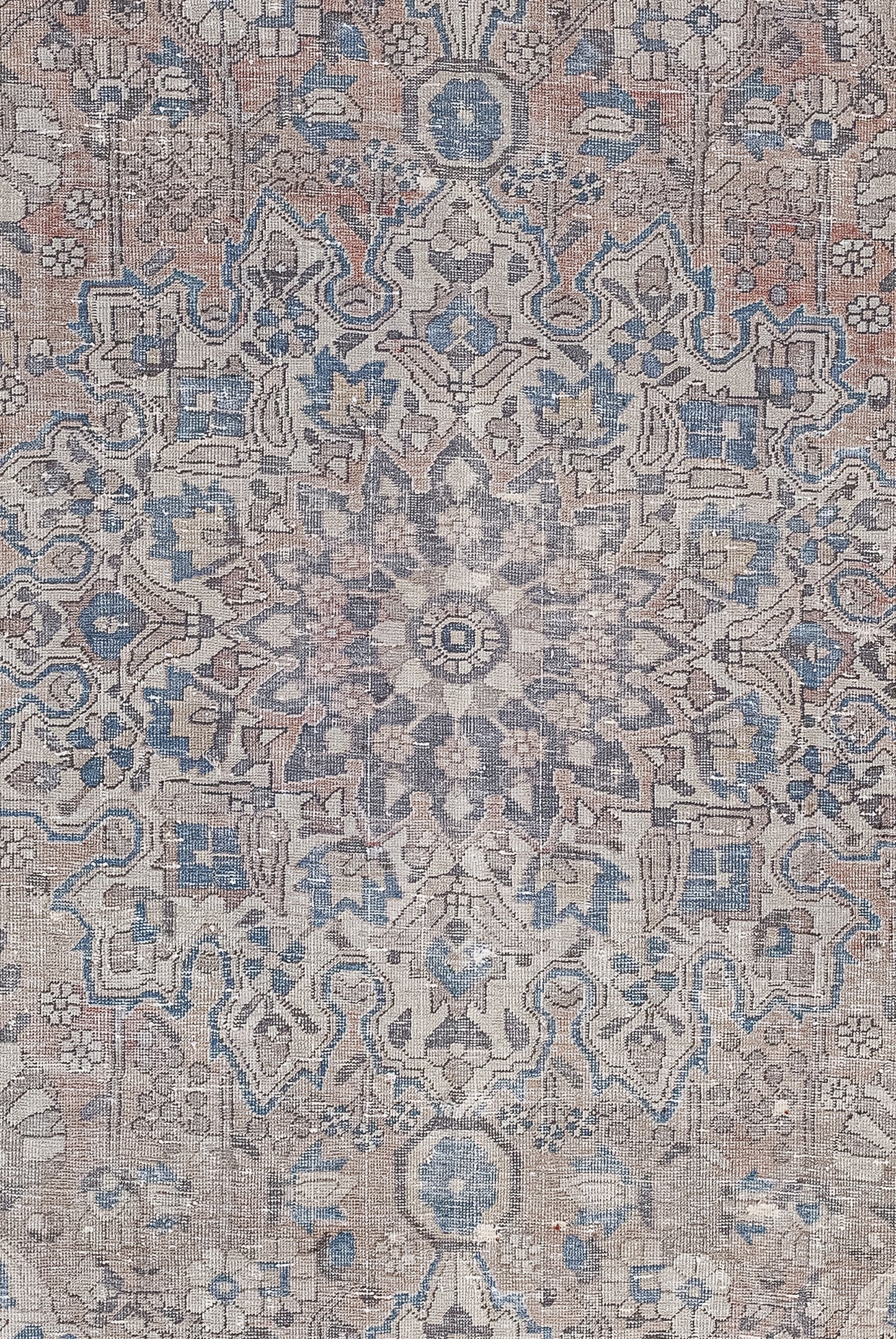 The close-up of the rug shows a huge mandala full of small details and flowers.
