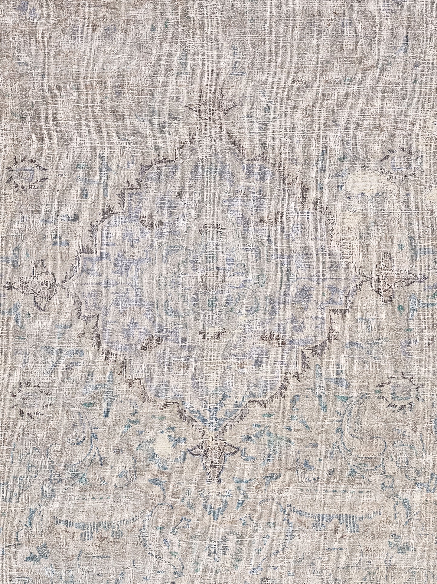 The foreground of the rug features a diamond-shaped ornament filled with symmetrical trims.