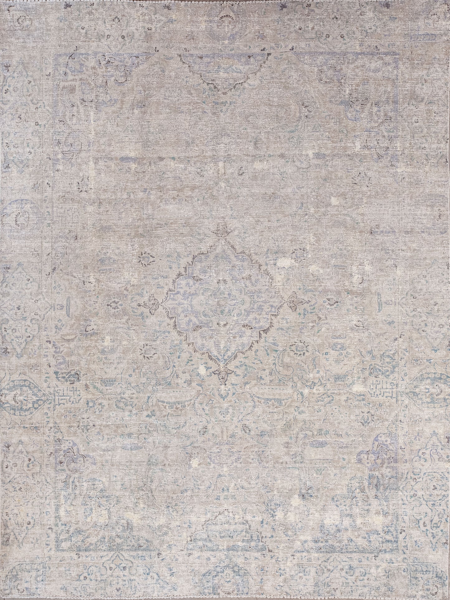 This venerable rug was woven with a distressed finish that makes it a non-slip rug. The color scheme has a beige background, and a bluish a pattern.