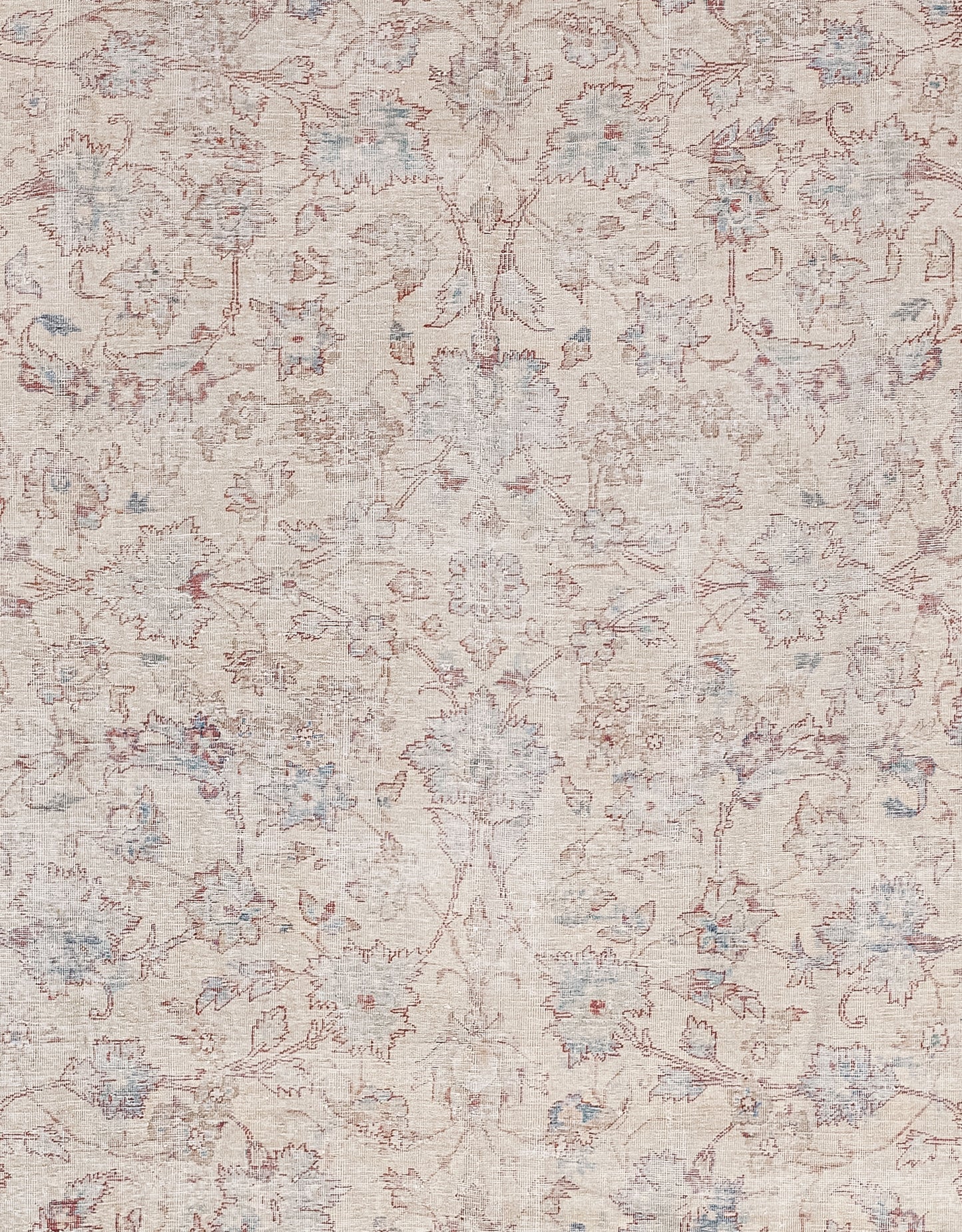 The foreground of the rug is a composition made up of symmetrically arranged autumn leaves.