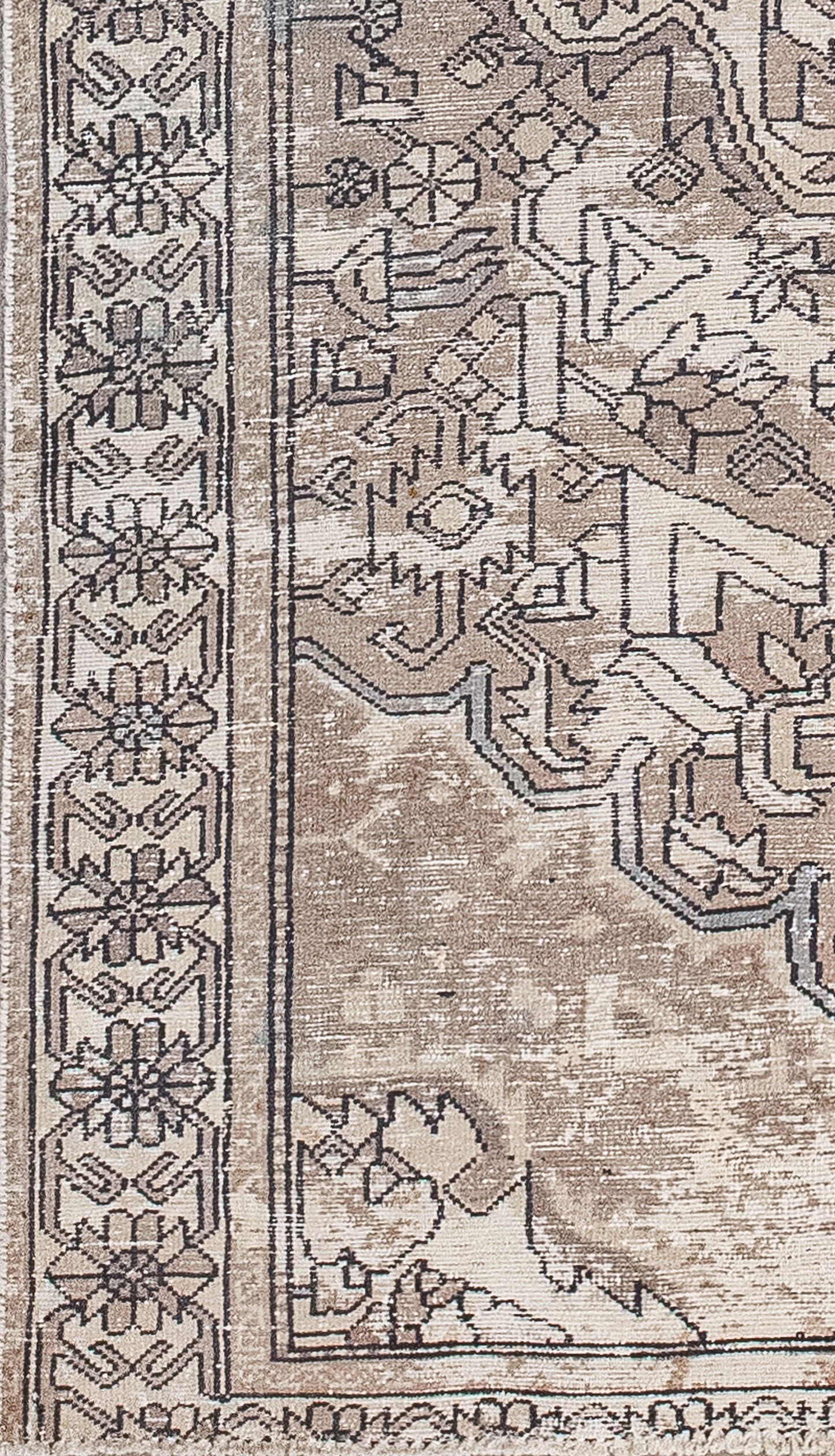 Geometric flower heads held together by hooks are woven over the thick beige outer frame.