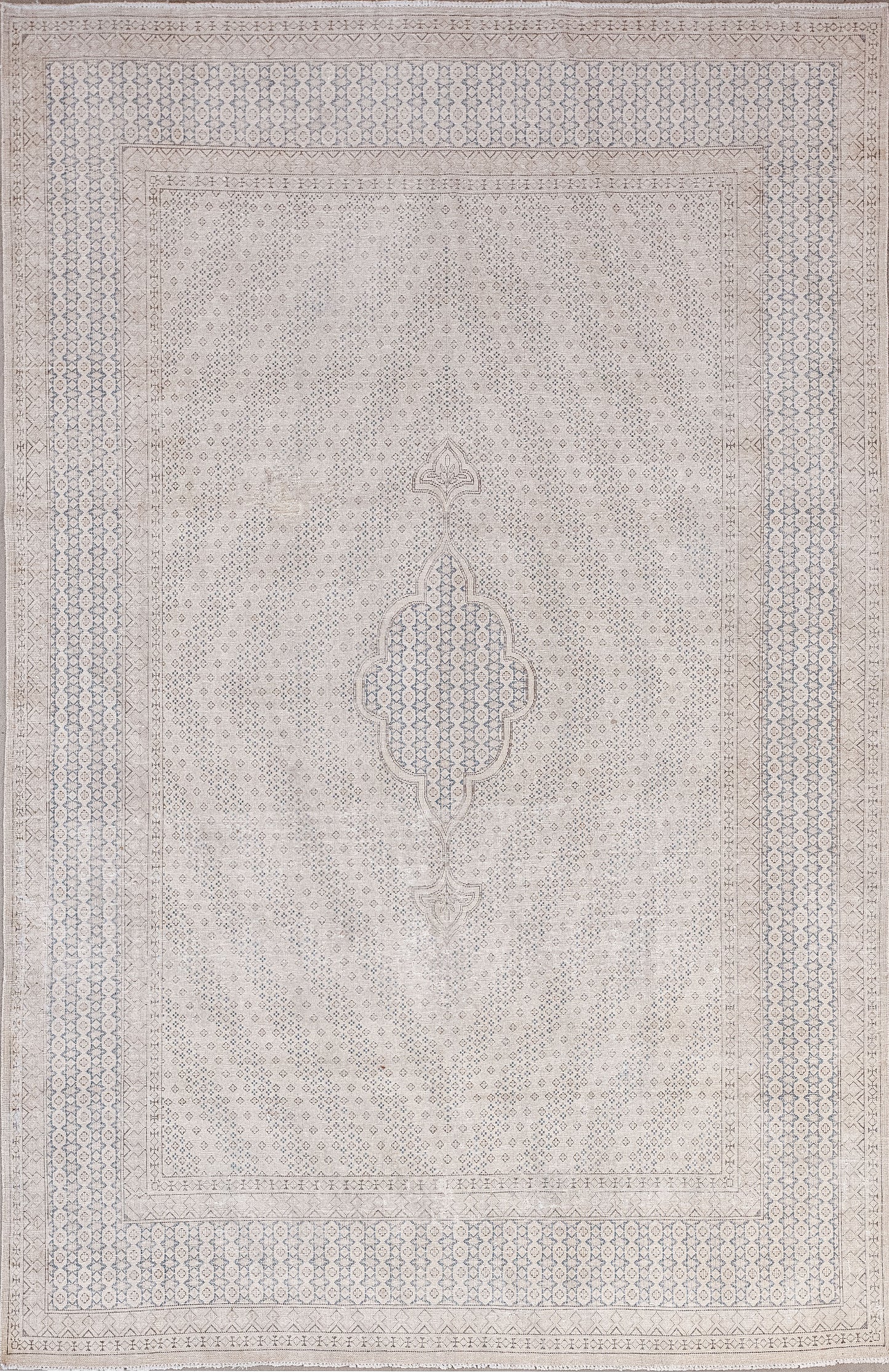Diamonds, rhombuses and lozenges were woven in all their glory on this rug. The pleasant color palette has mostly beige for the background, blue for the design, and black outlines.