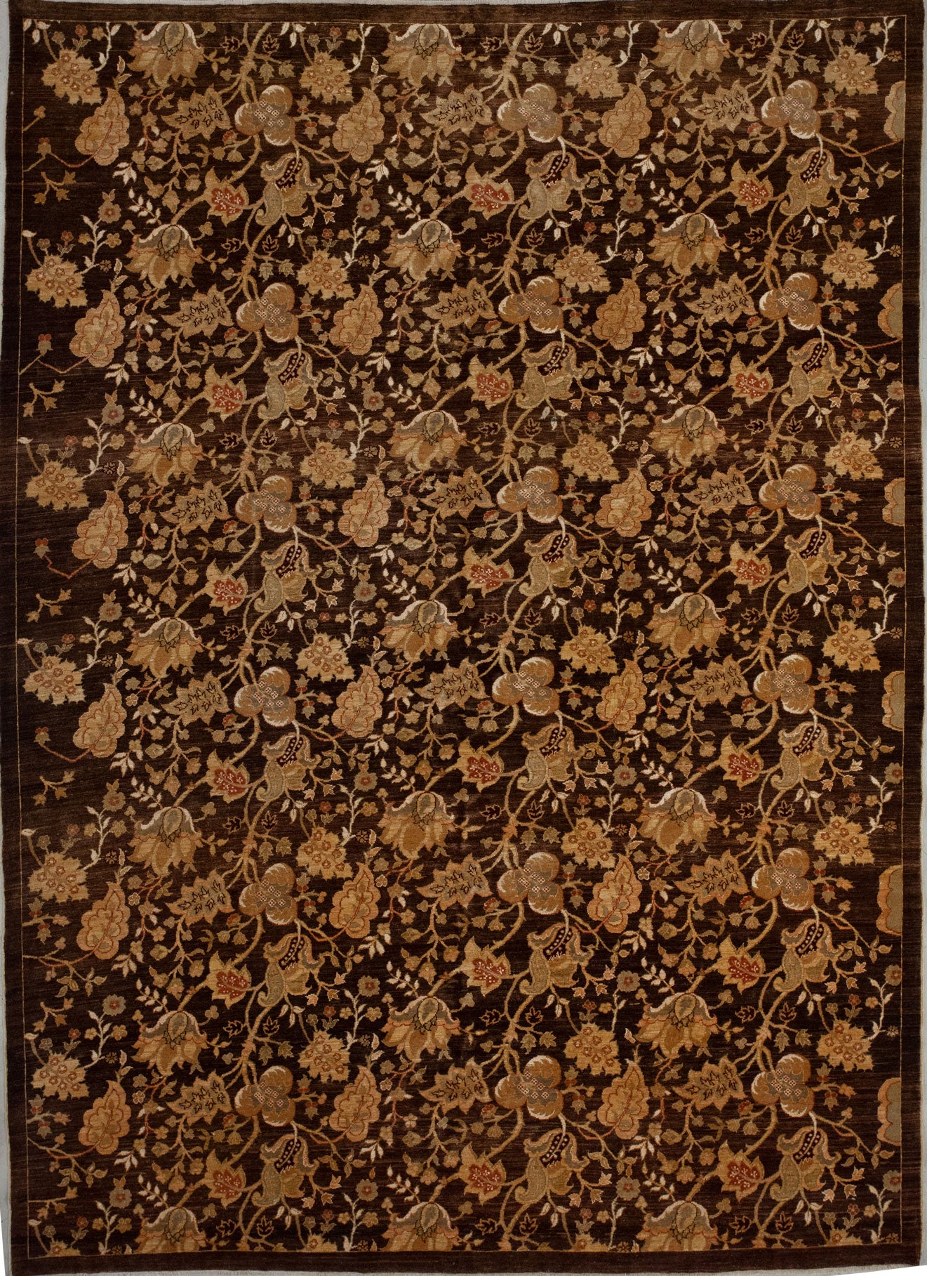 This classy rug comes with a climbing leaves and flowers pattern, and the color scheme has different tones of brown, black, and details in burgundy.