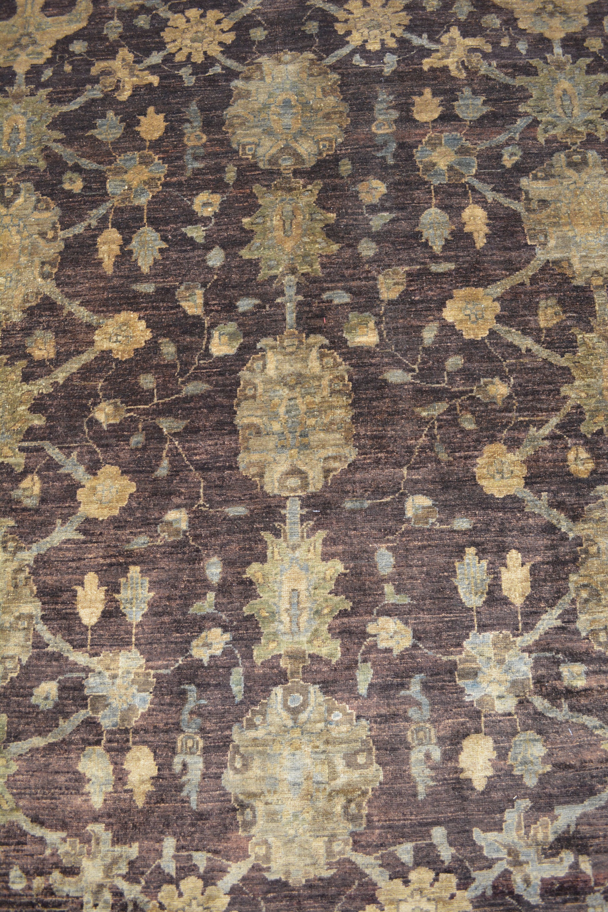 The symmetric pattern displays flowers, leaves, and ornaments arranged symmetrically.