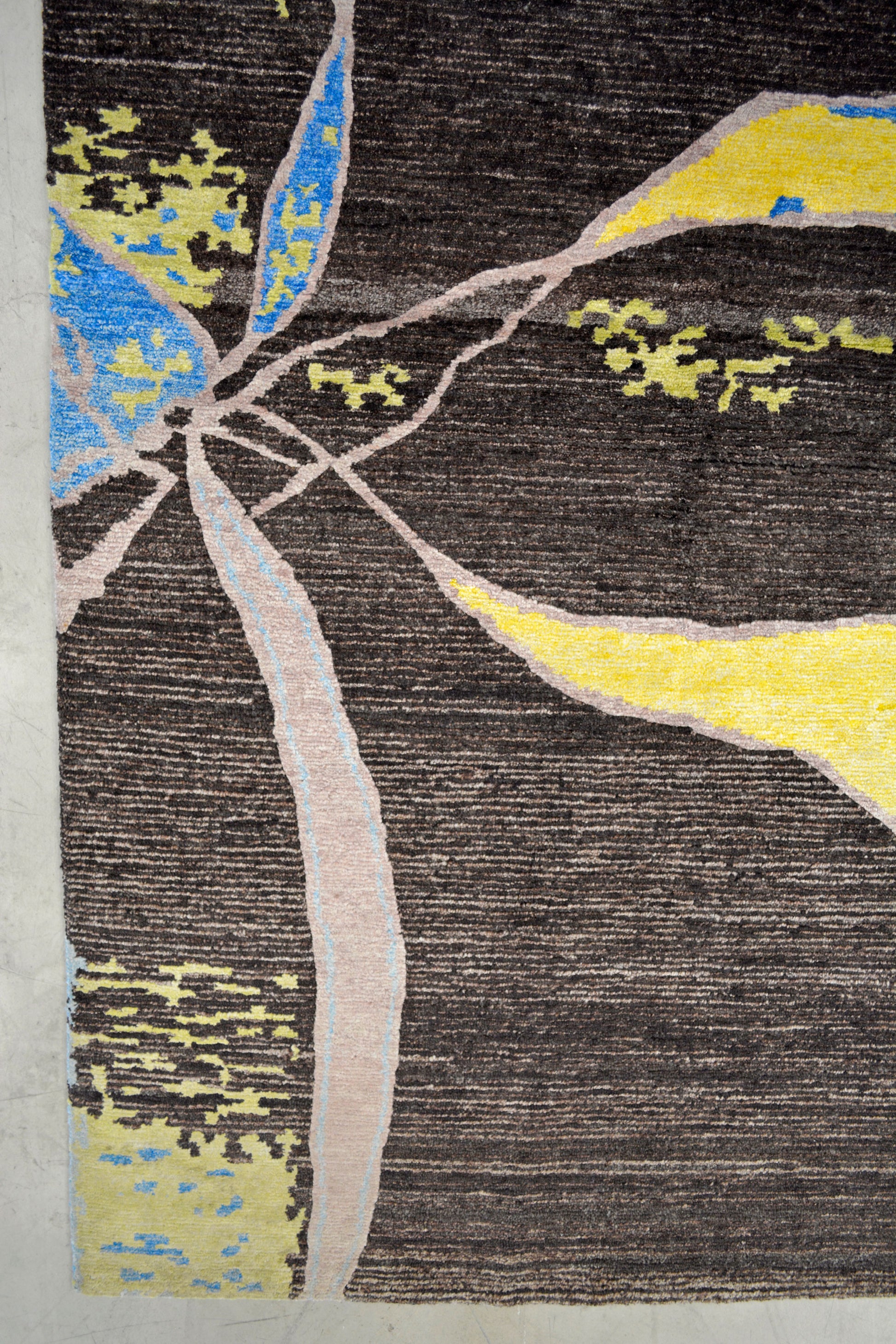 On the bottom left corner, there is an abstract petals representation.