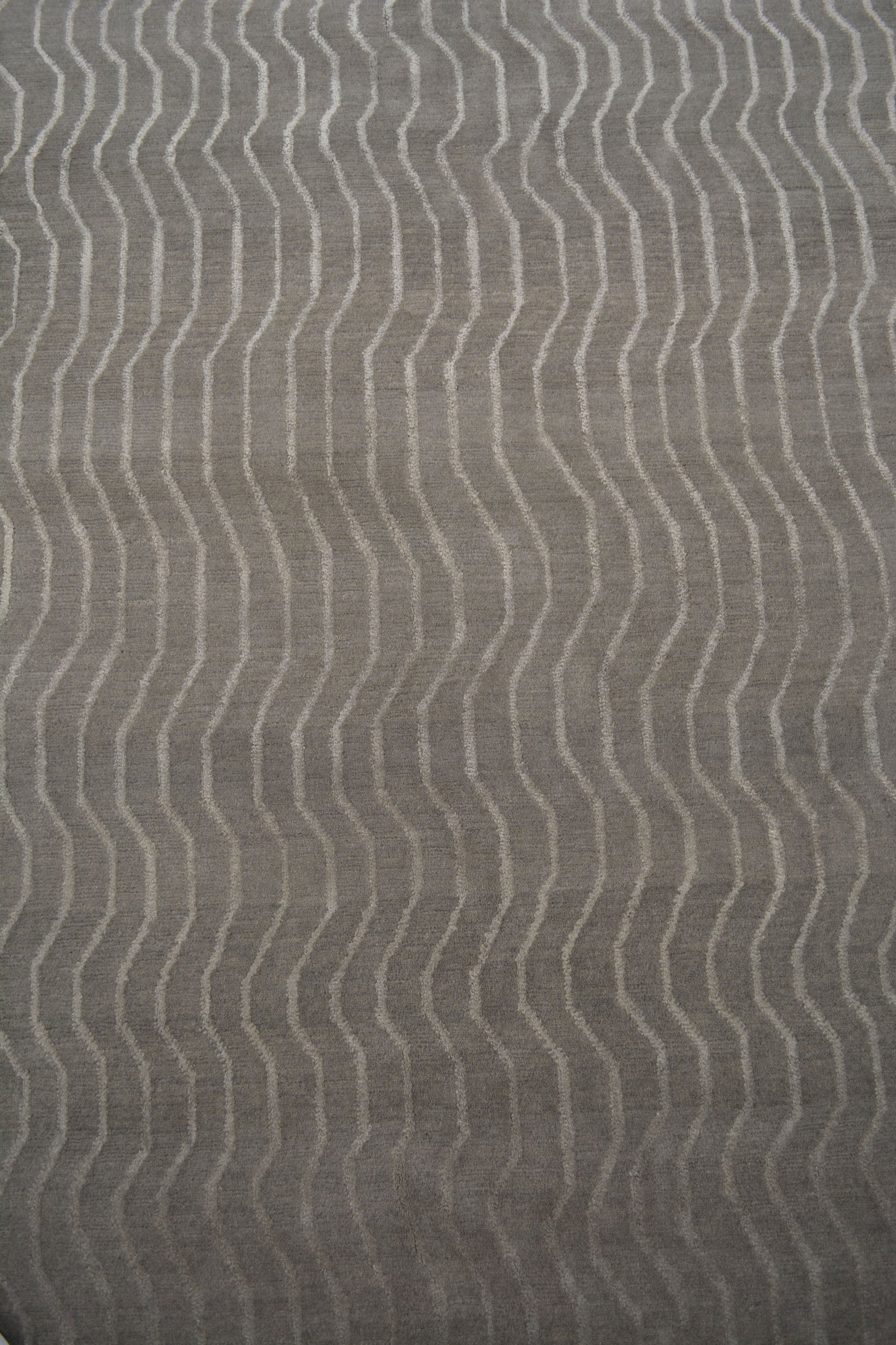 The center's close-up shows that every wave line has the same separation from each other.