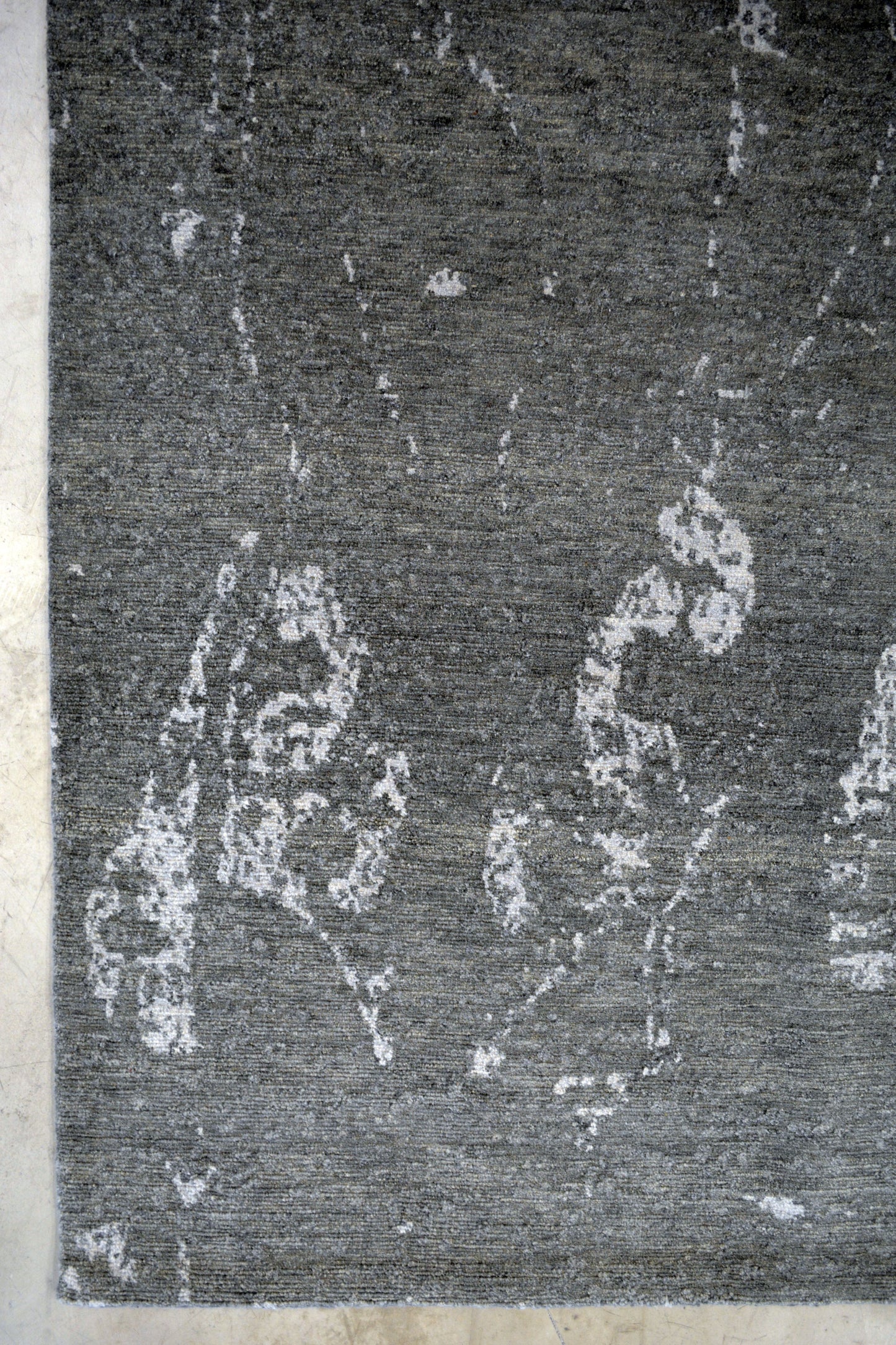 On the bottom left corner, there are small abstract ornaments.