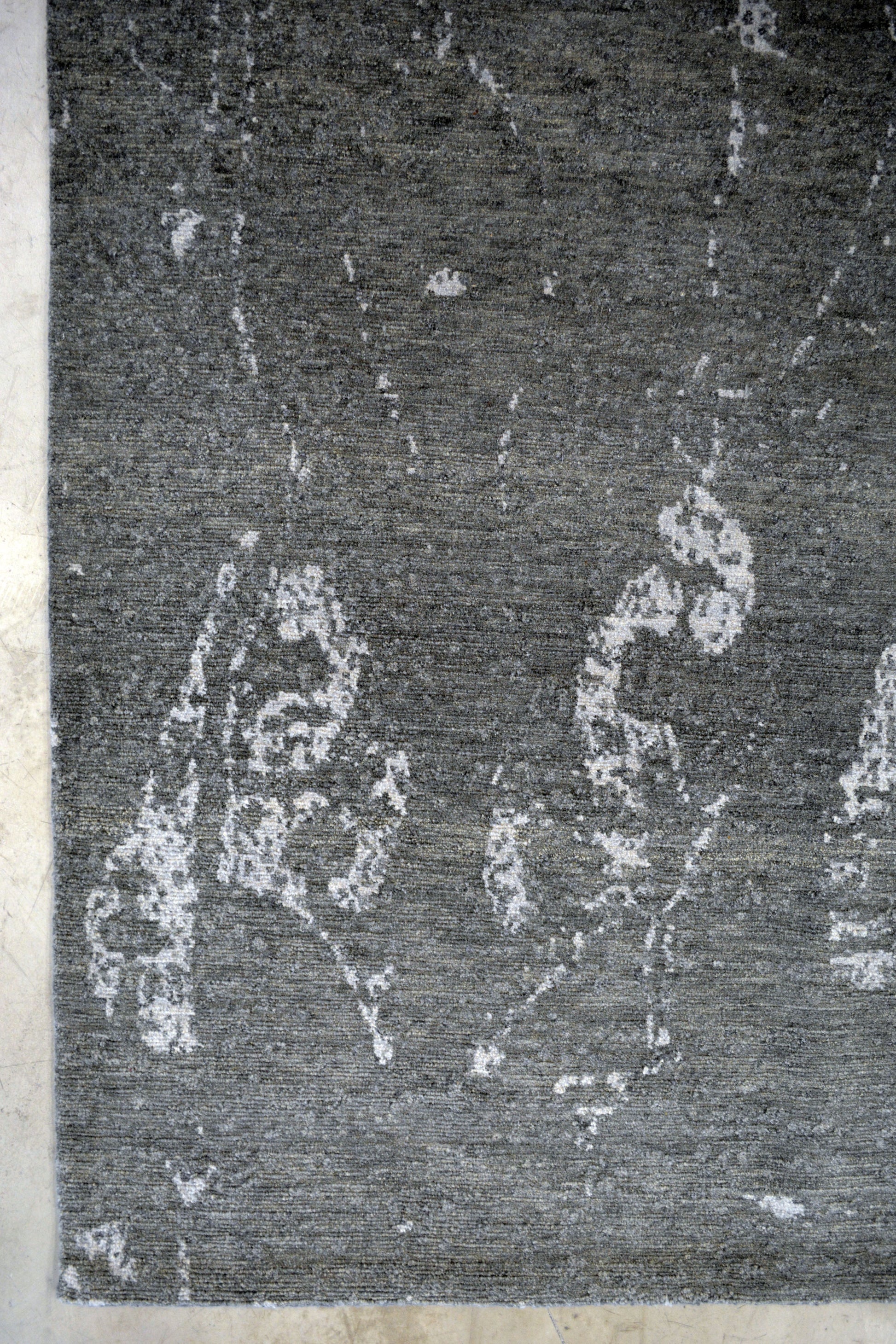 On the bottom left corner, there are small abstract ornaments.