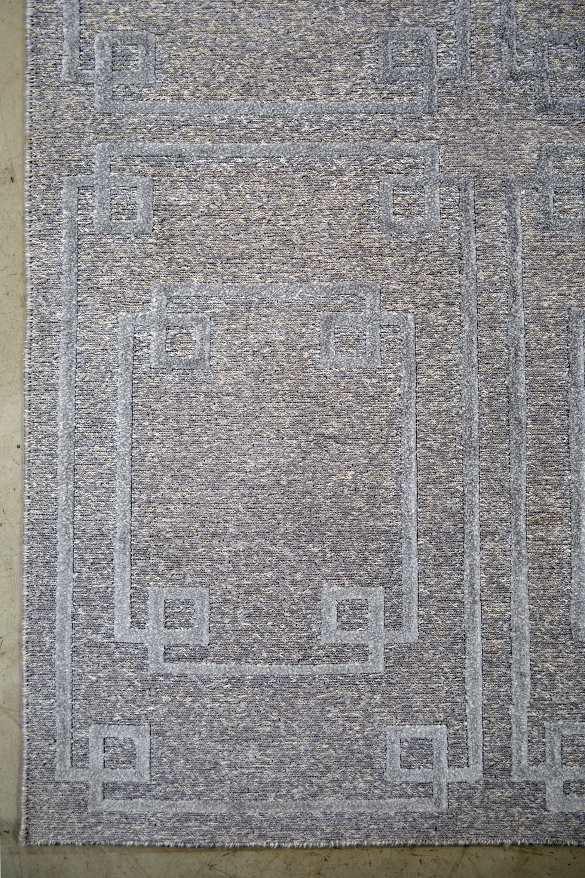 On the bottom left corner, there is the first rectangle showing with fancy inverse corners. Moreover, it contains the same rectangle inside, but smaller.