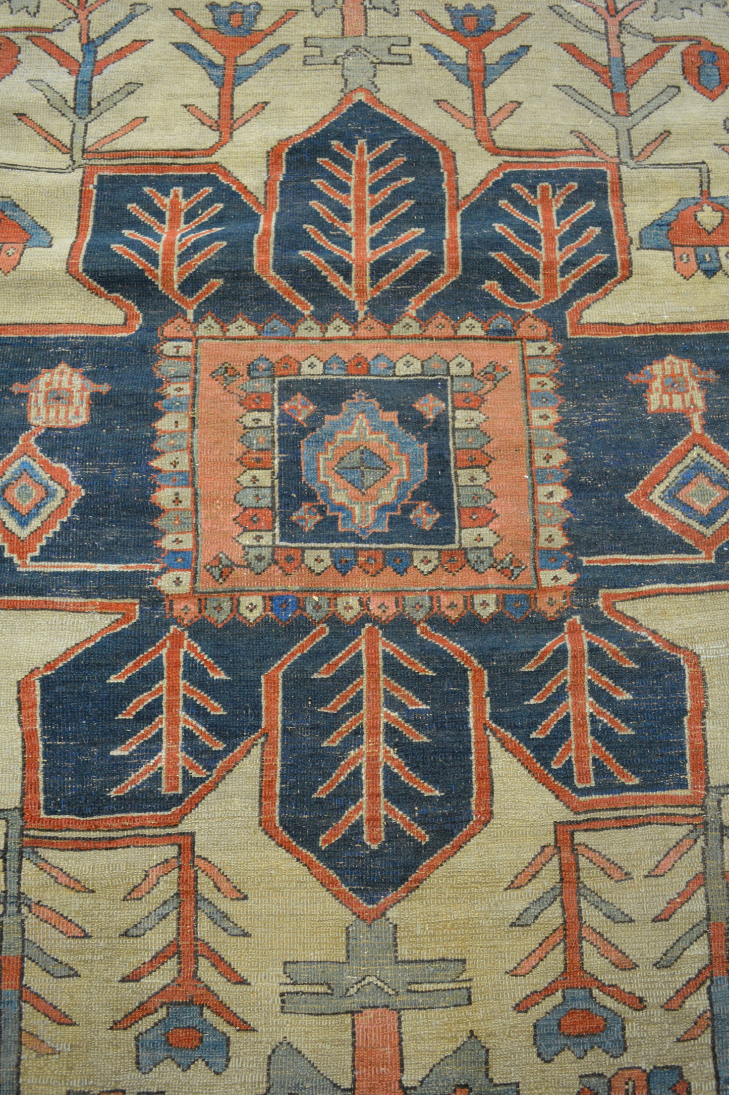 The center's close up renders a big navy blue sun shape with branches pattern inside.