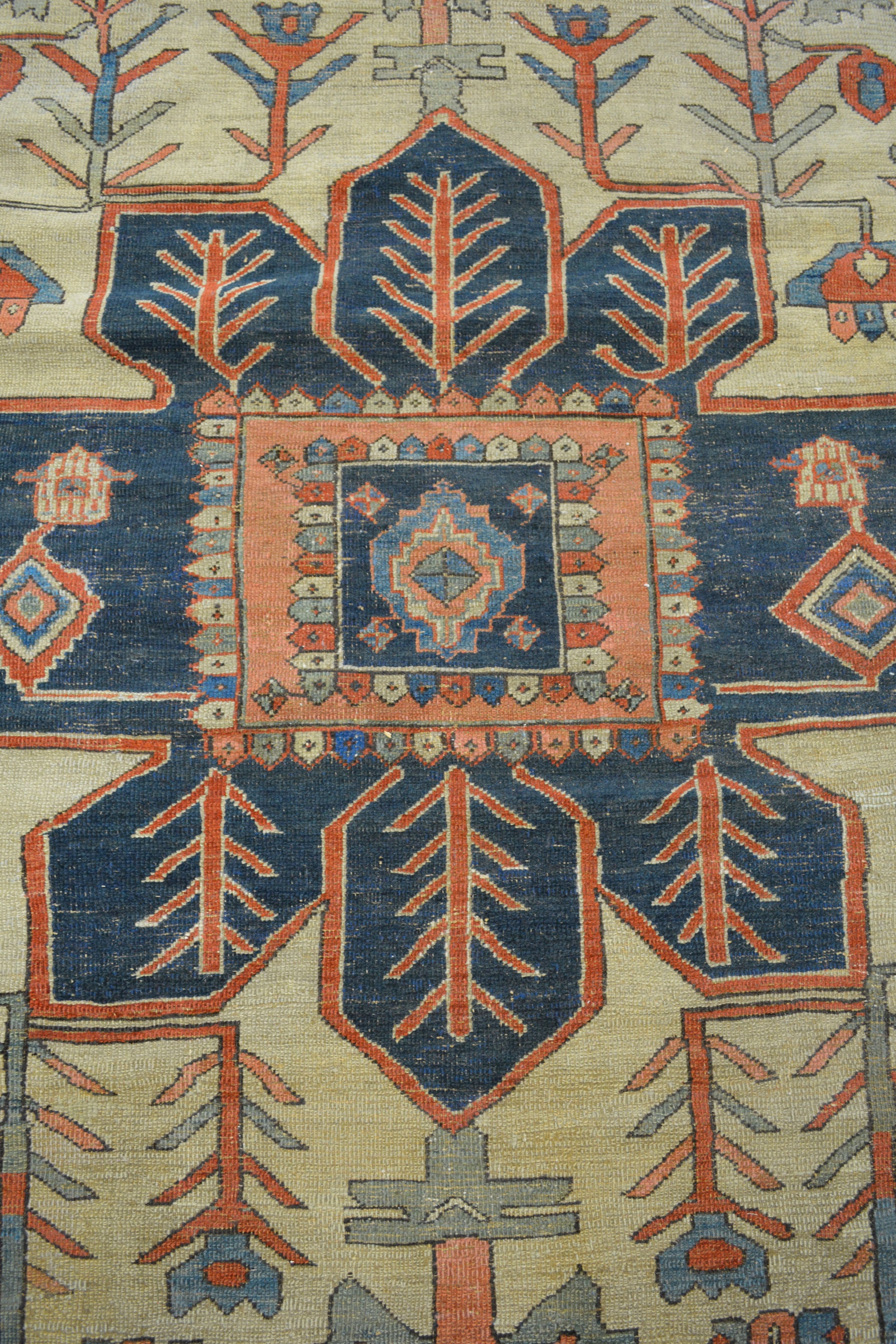 The center's close up renders a big navy blue sun shape with branches pattern inside.