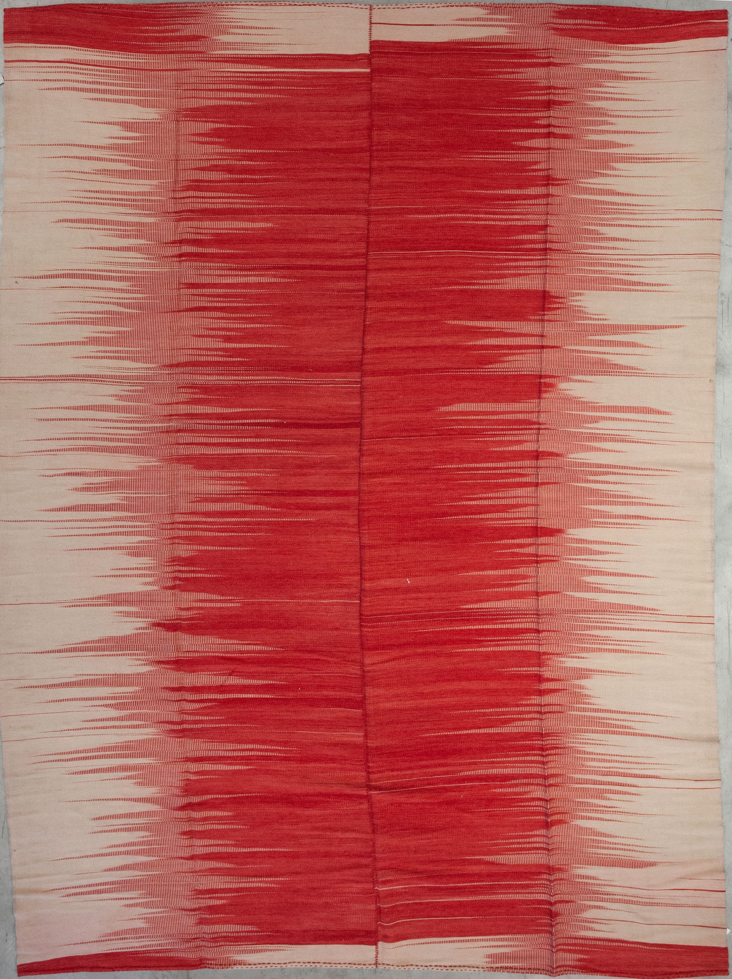 This fiery rug was knitted within the classic style. The dominant color is red and white for contrasting purposes.