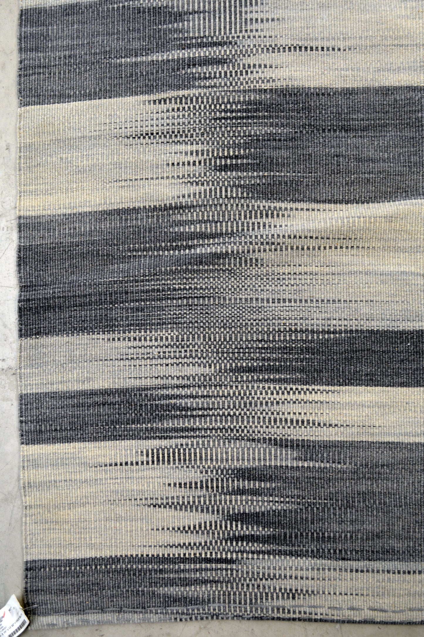 The classic rug's style renders an abstract checkers board representation.