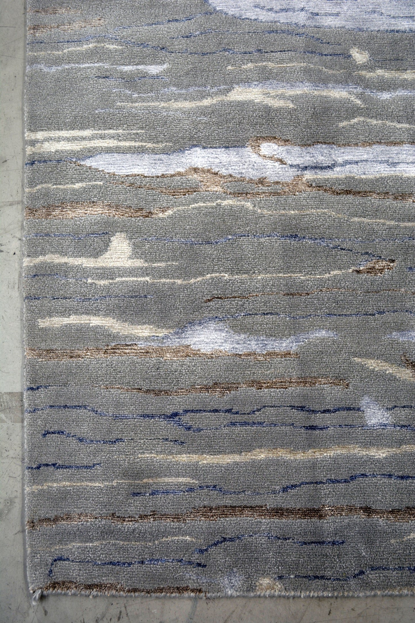 The color scheme is gray, blue, beige, and brown highlights.