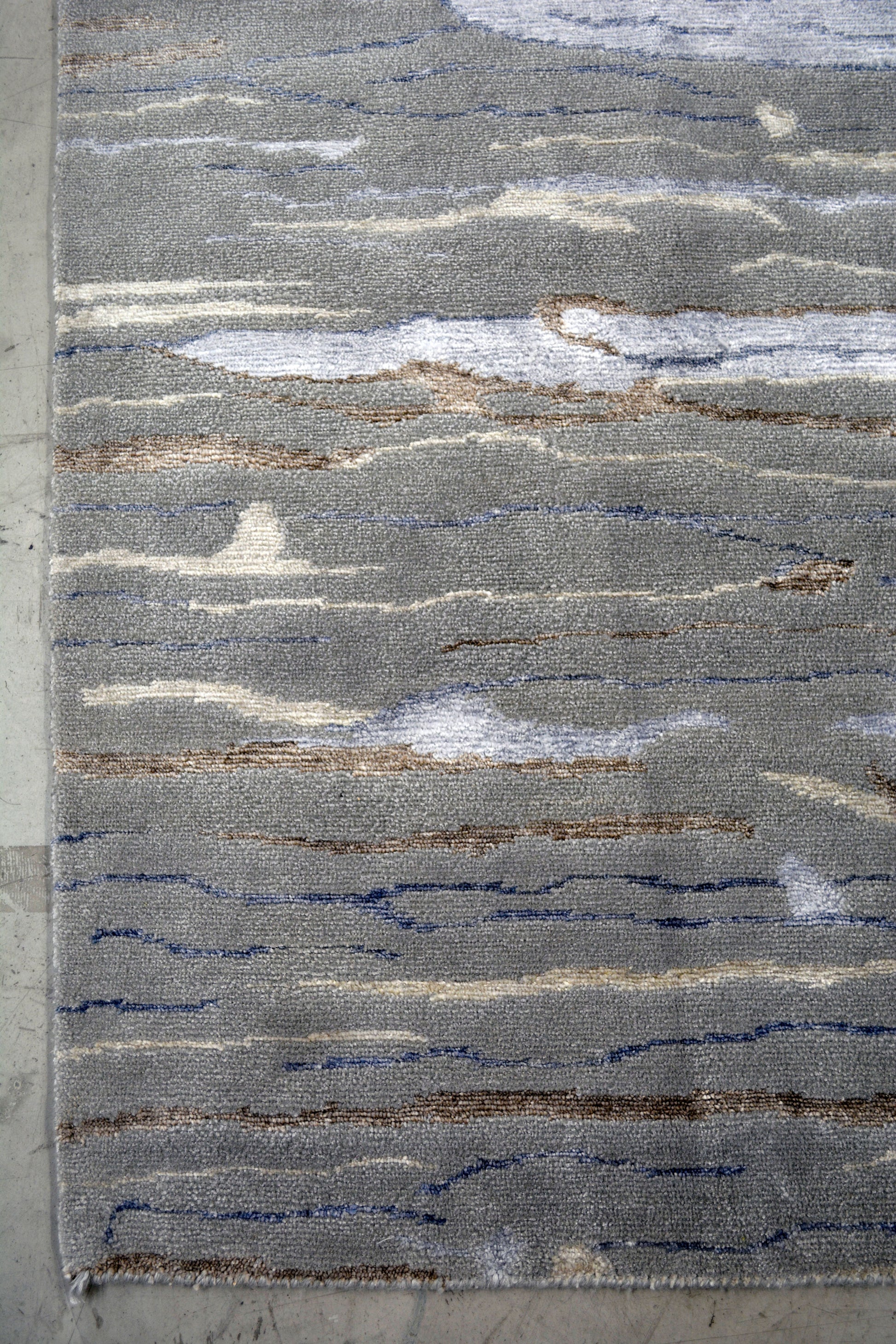 The color scheme is gray, blue, beige, and brown highlights.