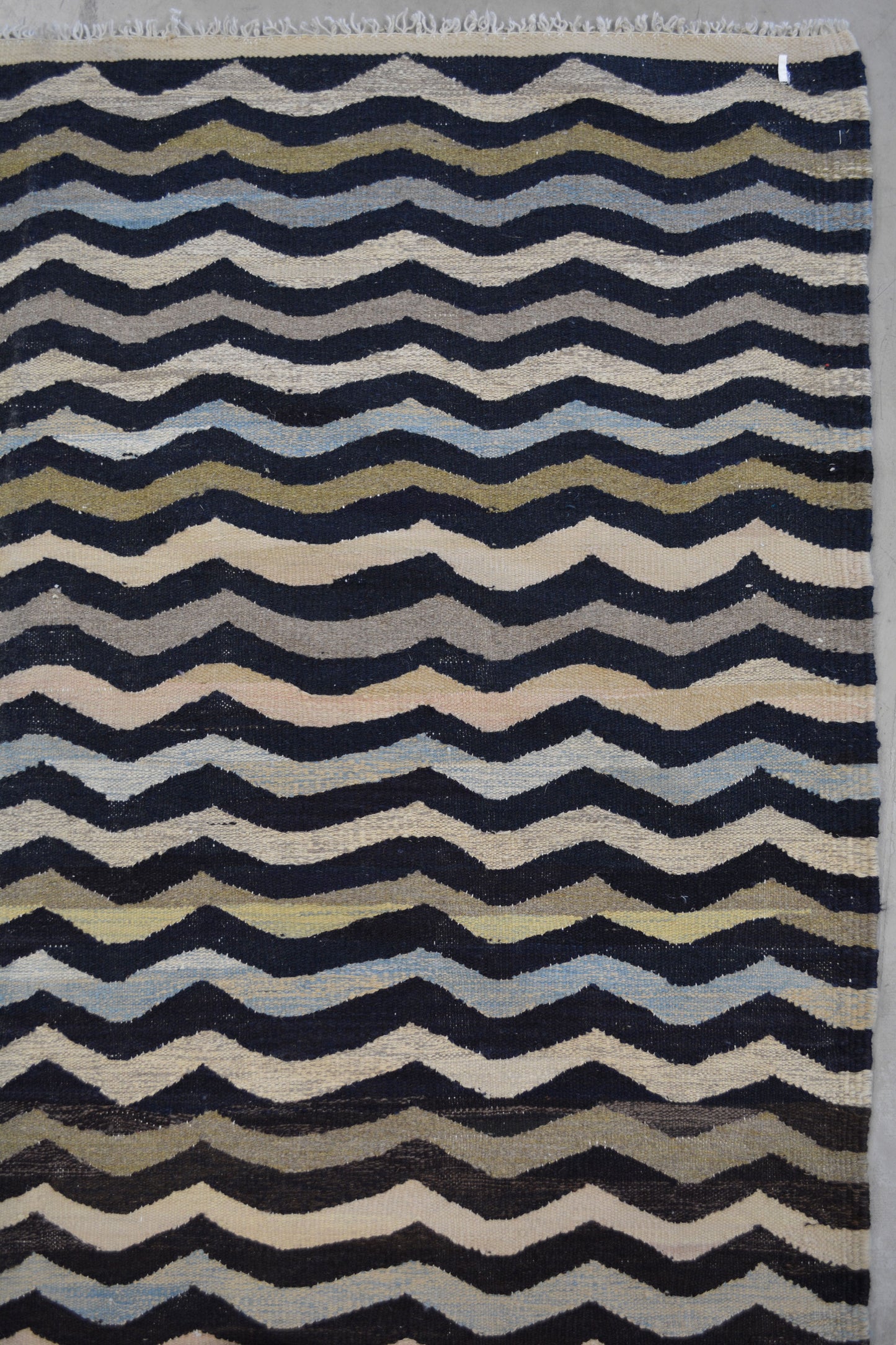 the color scheme displays white, blue, pink, green, gray, and mostly black.