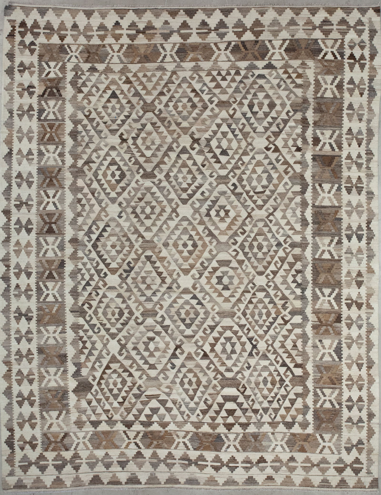 This carpet comes with beige background and a greco roman pattern in gray and brown.