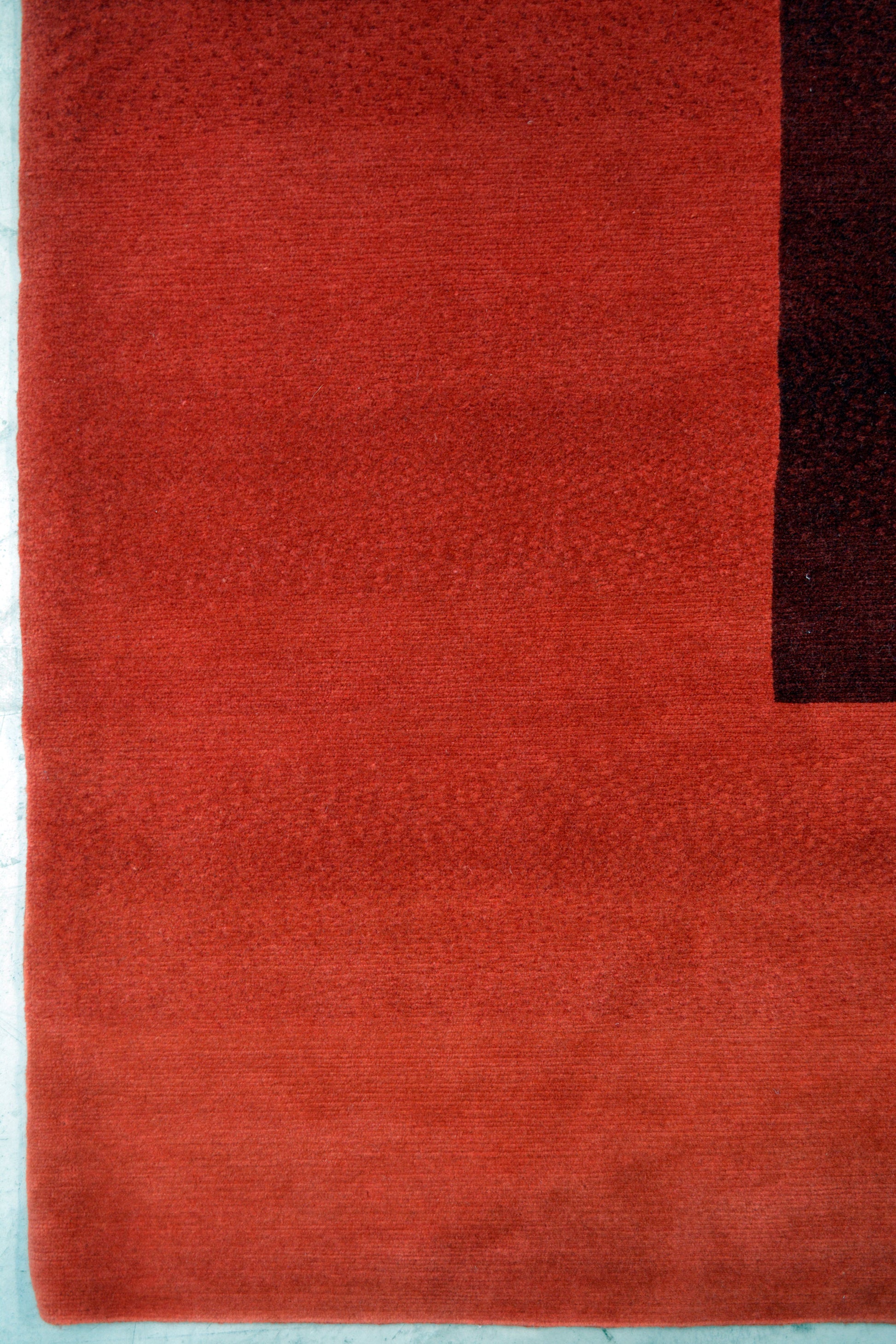 This energetic carpet comes in red, and the design renders two gradients