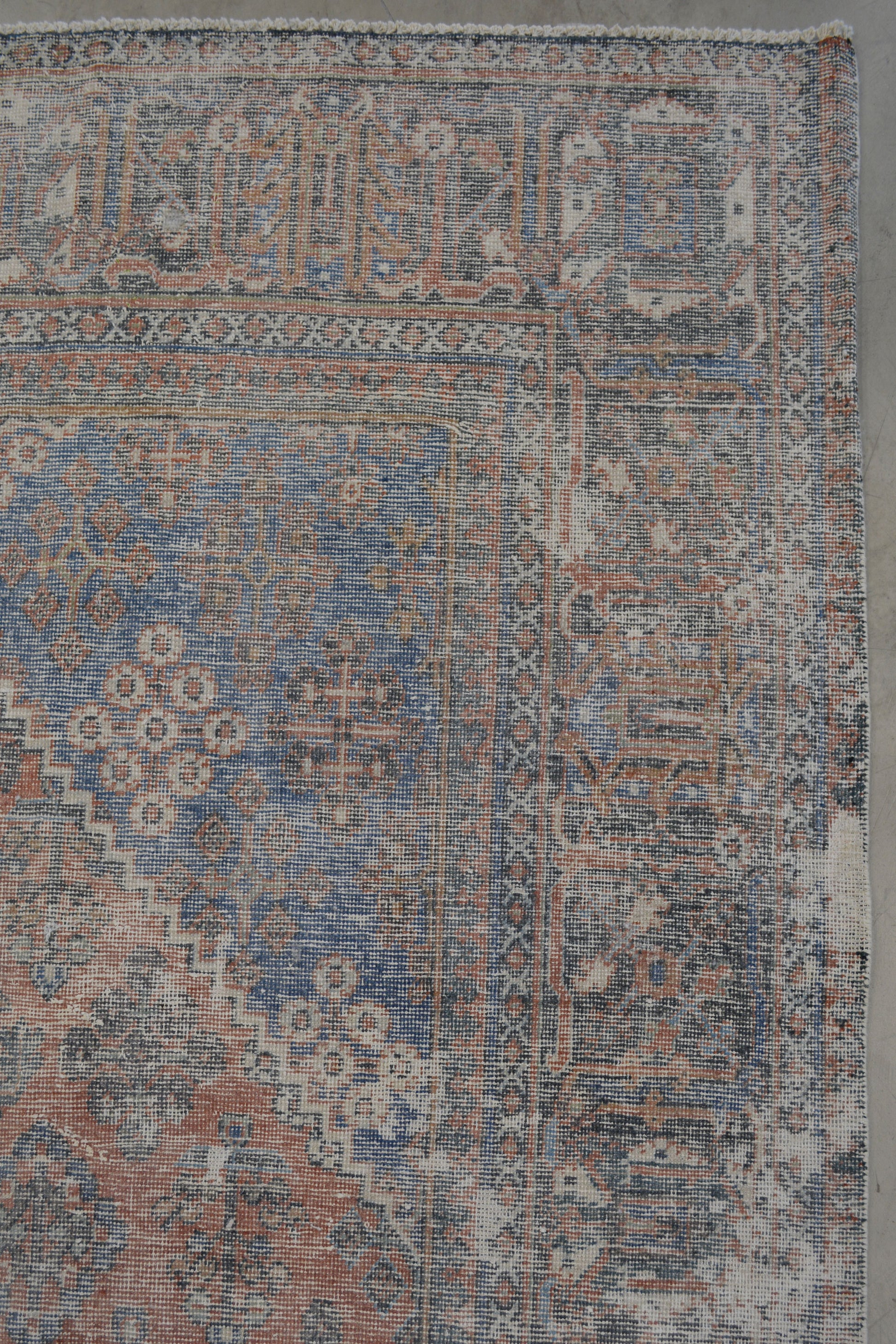 On the top right corner, there is a thicker frame which has a geometrical pattern.