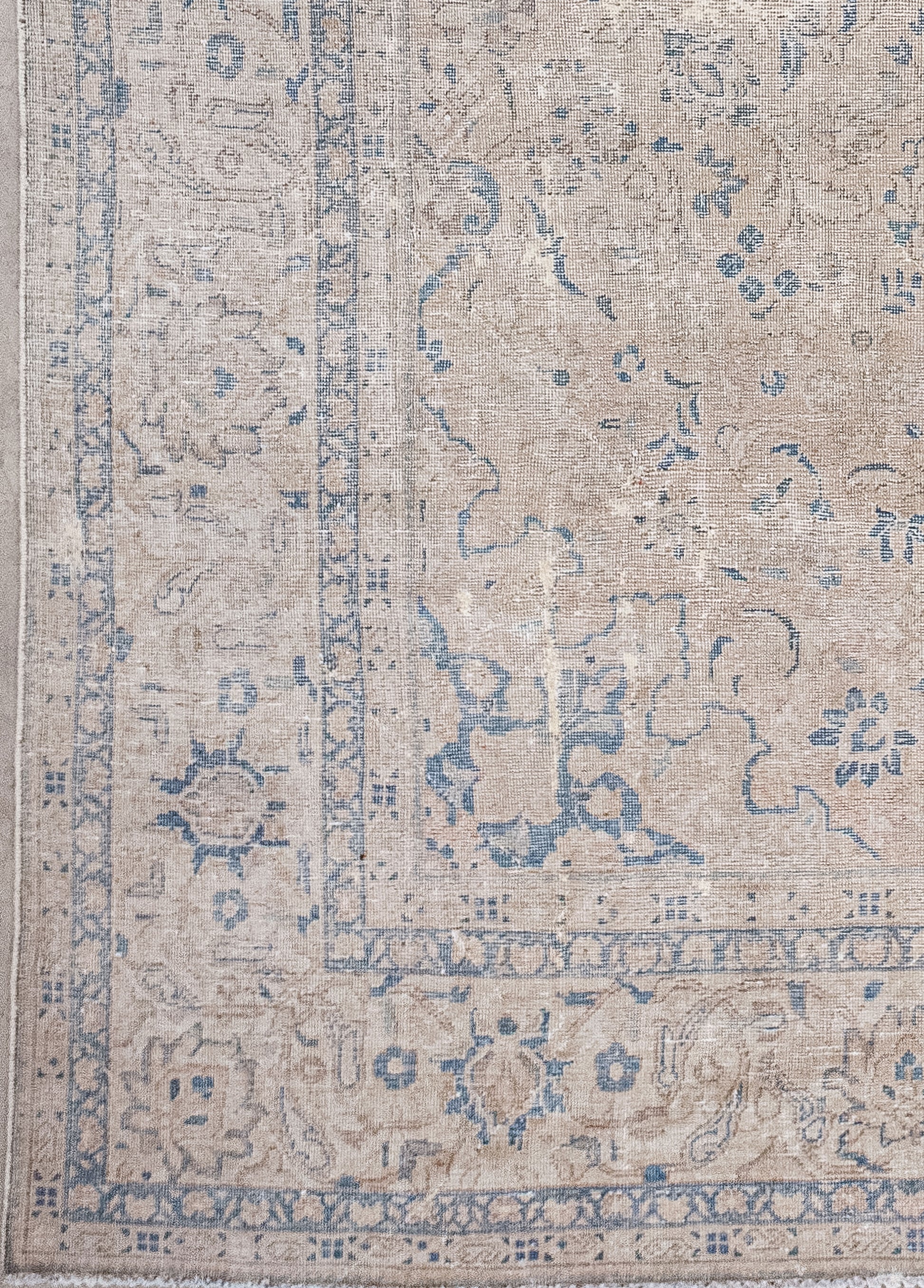 From the lower corner towards the entire margin, there are two thin borders with squares and butterflies patterns.