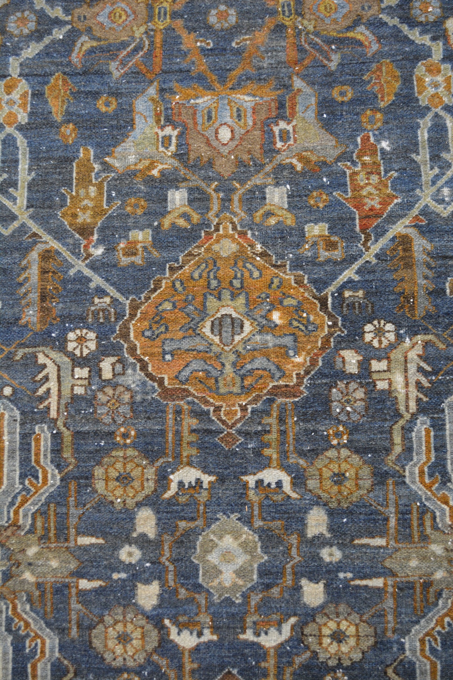 The center's close up displays spades, pieces of wood, and flowers as pattern.