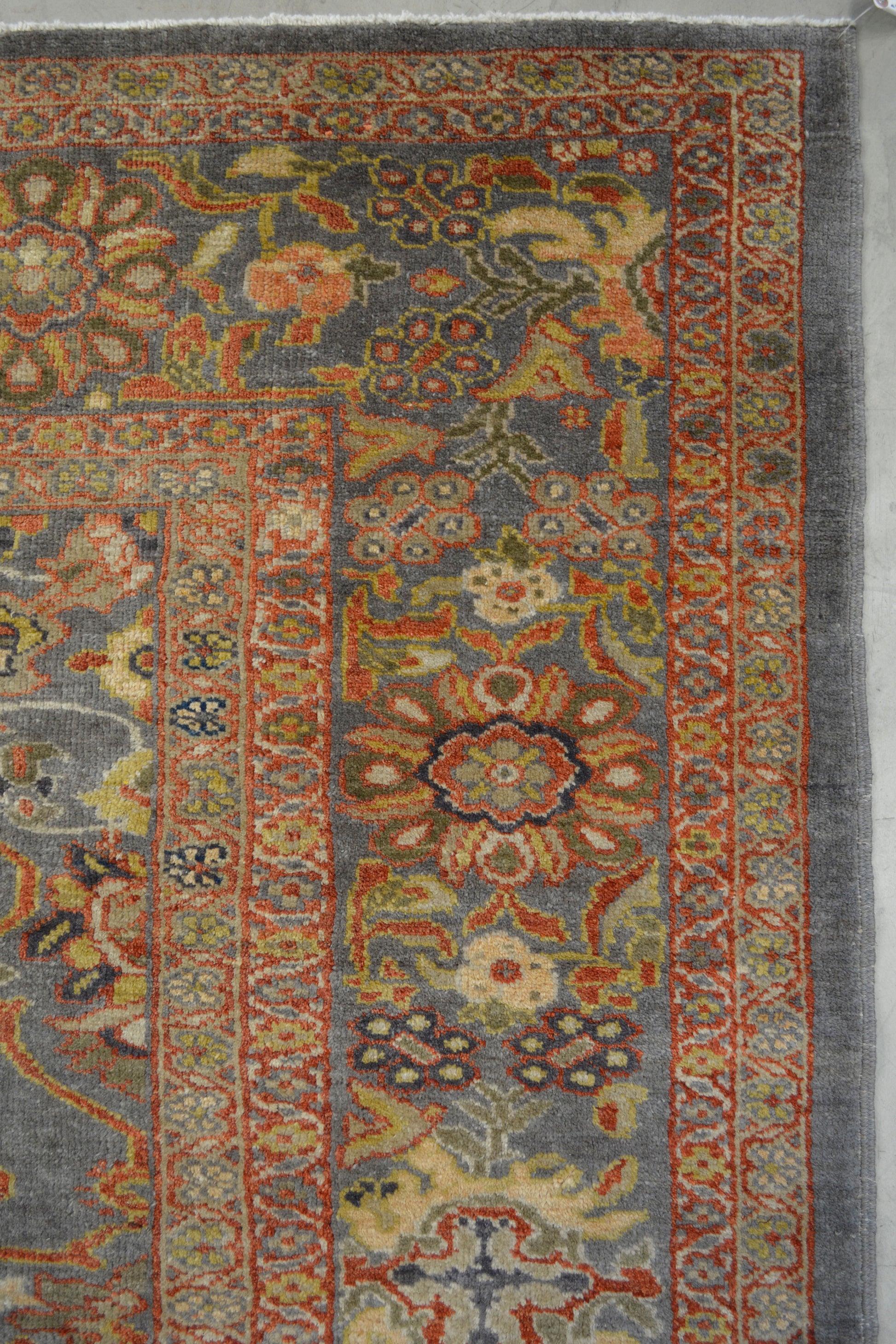 On the top right corner there is a thicker gray frame with exotic colored big flowers.