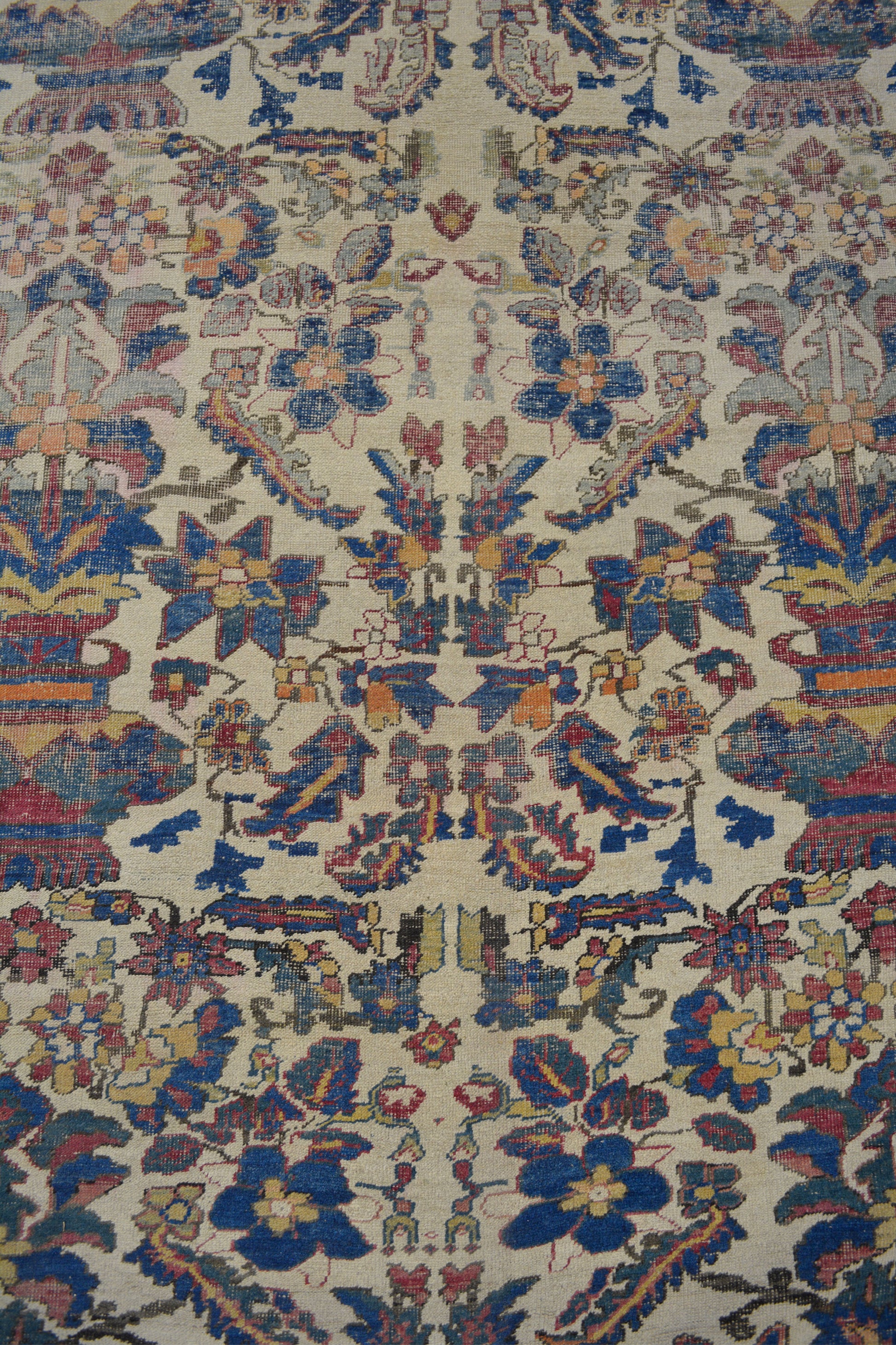 In the center's close-up there are blue and yellow flowers, and gray leaves.