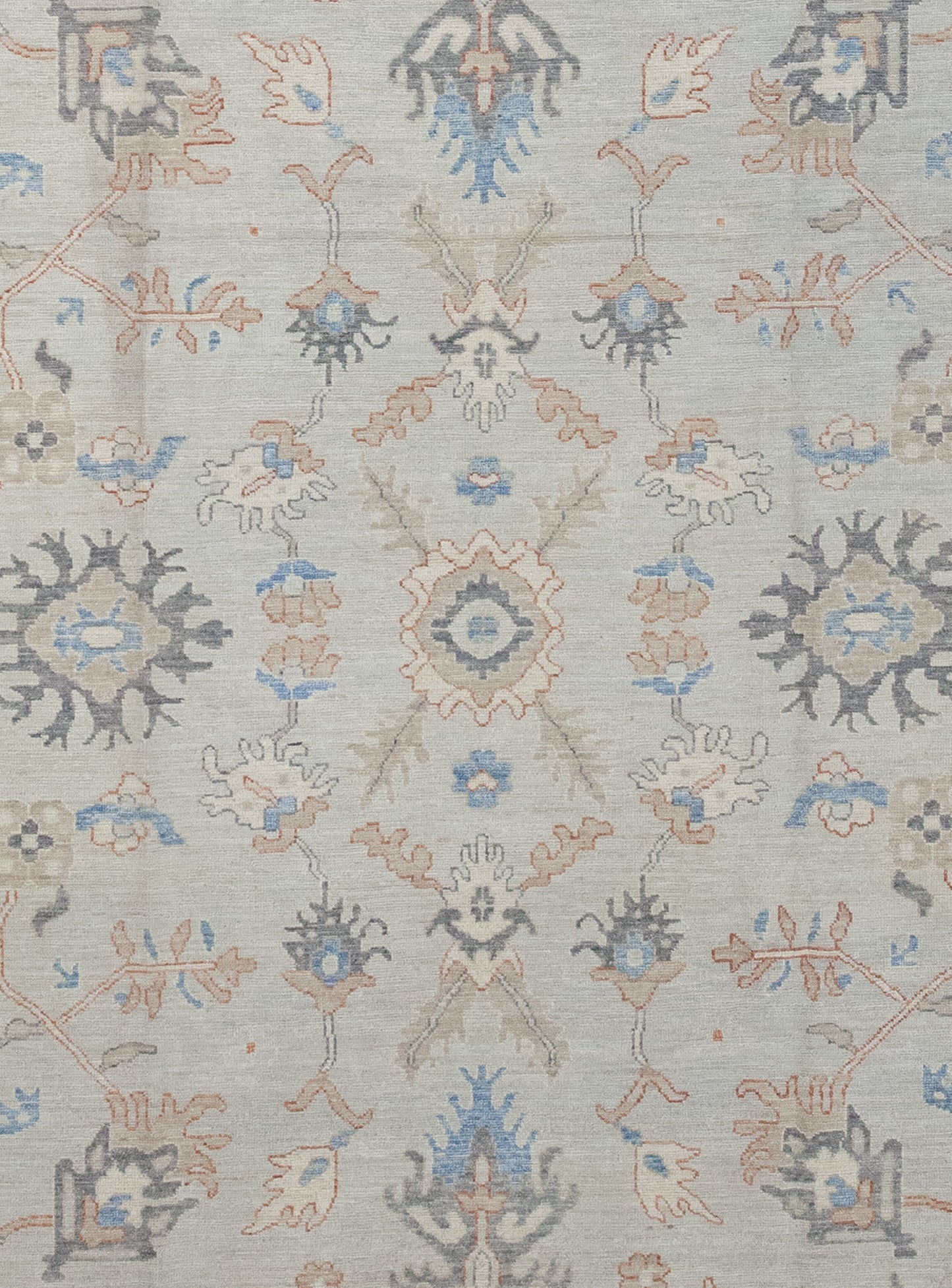 The rug's center displays more of the graphics arranged symmetrically.