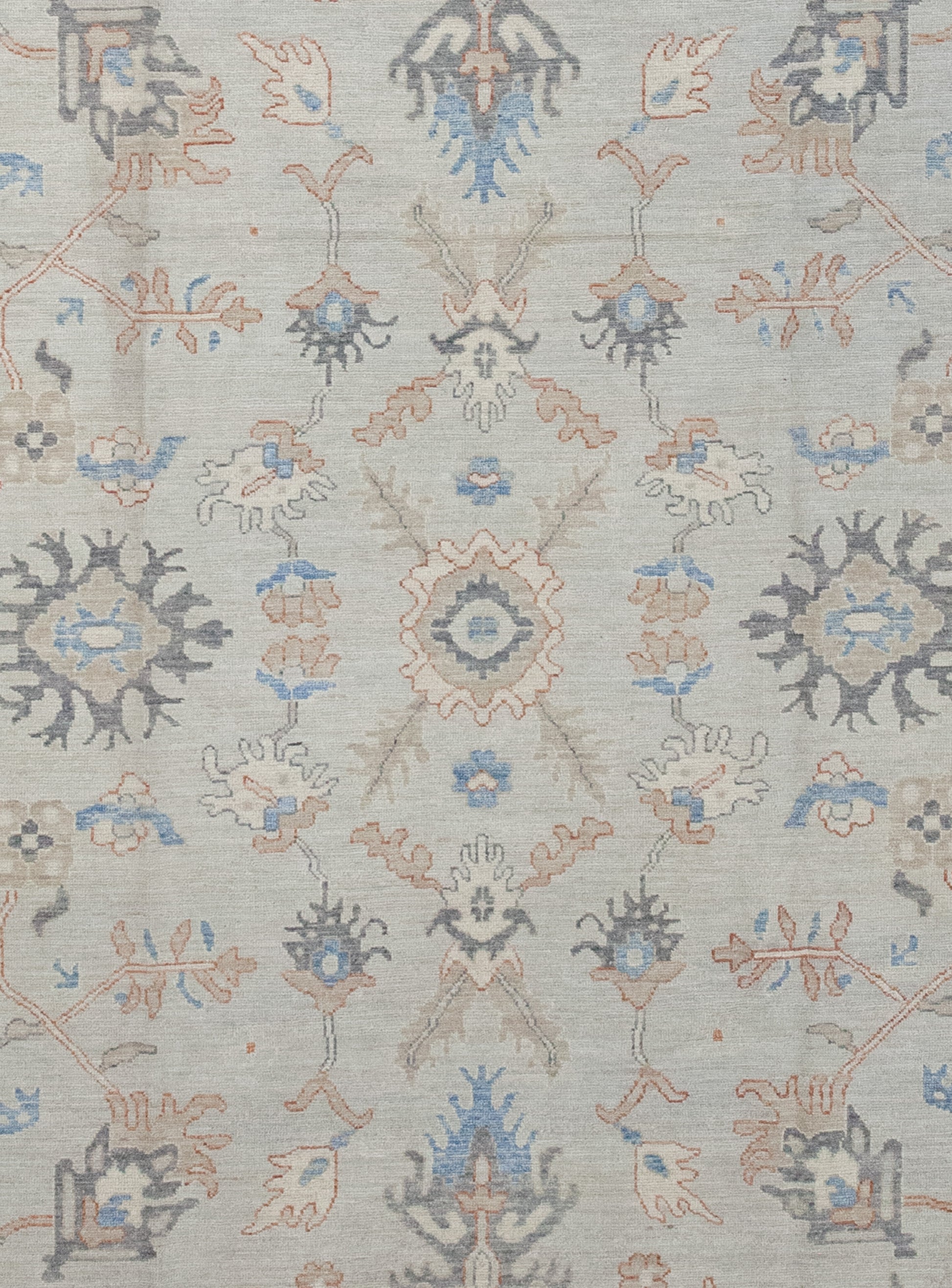 The rug's center displays more of the graphics arranged symmetrically.