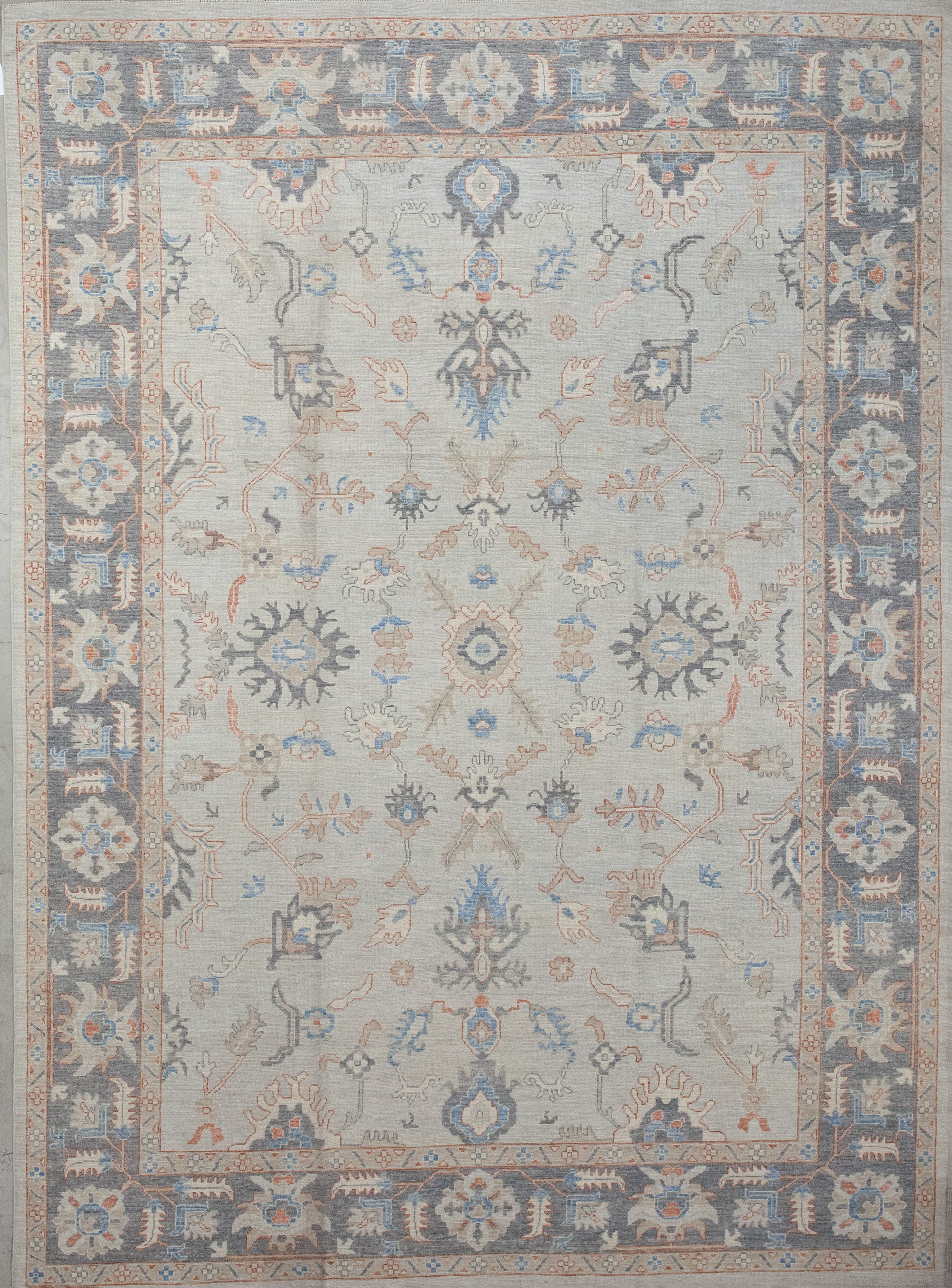First-rate carpet comes with an elegant color scheme which has variations of gray, orange, and blue. The symmetrical design renders thin branches, autumn leaves, and snowflake shapes.