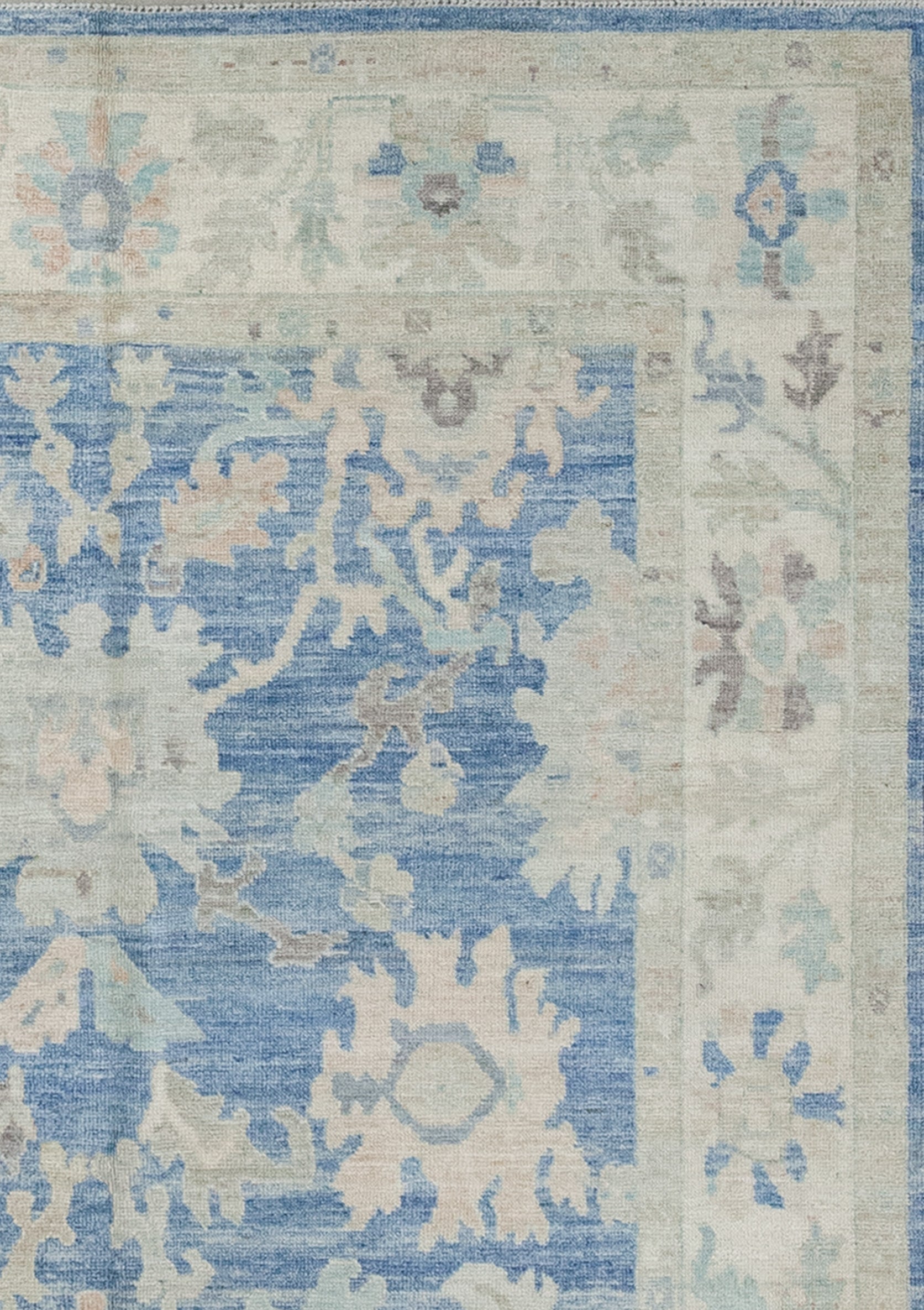 The gray borders have a fainted pattern which barely shows, while the thick frame displays big colorful flowers, and branches with leaves on the sides.