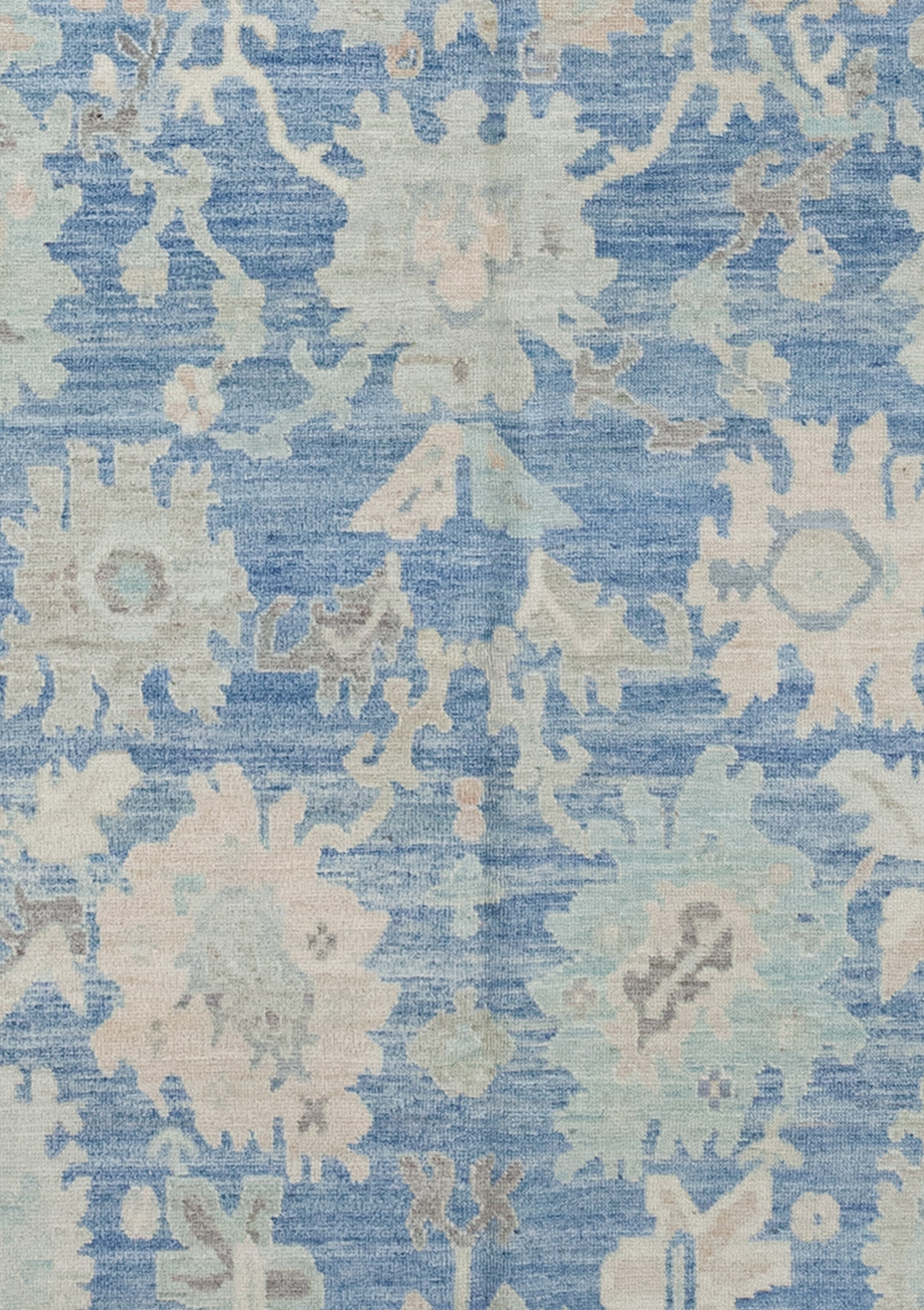 The rug center's close-up renders the artwork symmetrically, but with color variations.