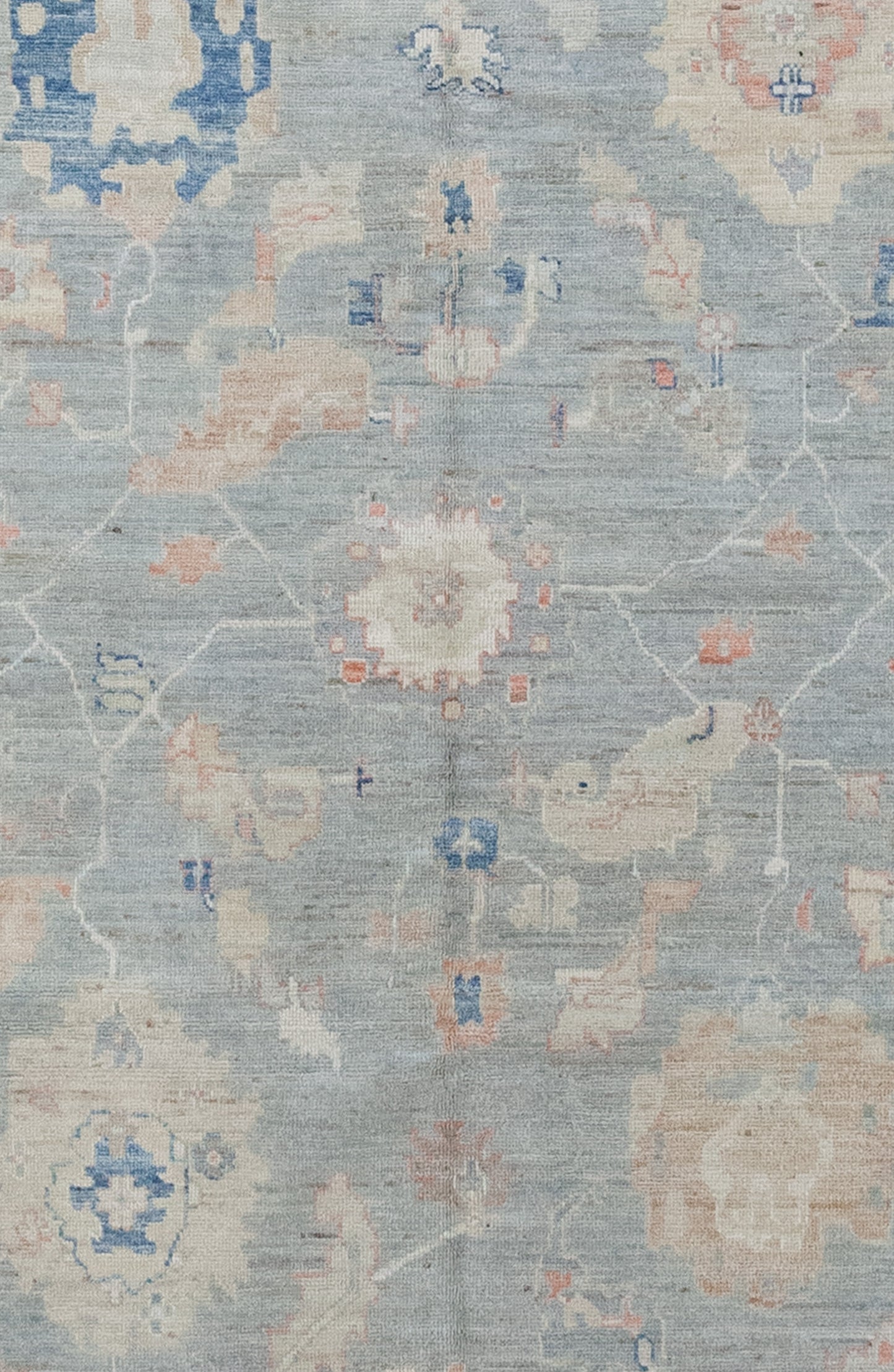 The center of the carpet features large colorful coral heads.