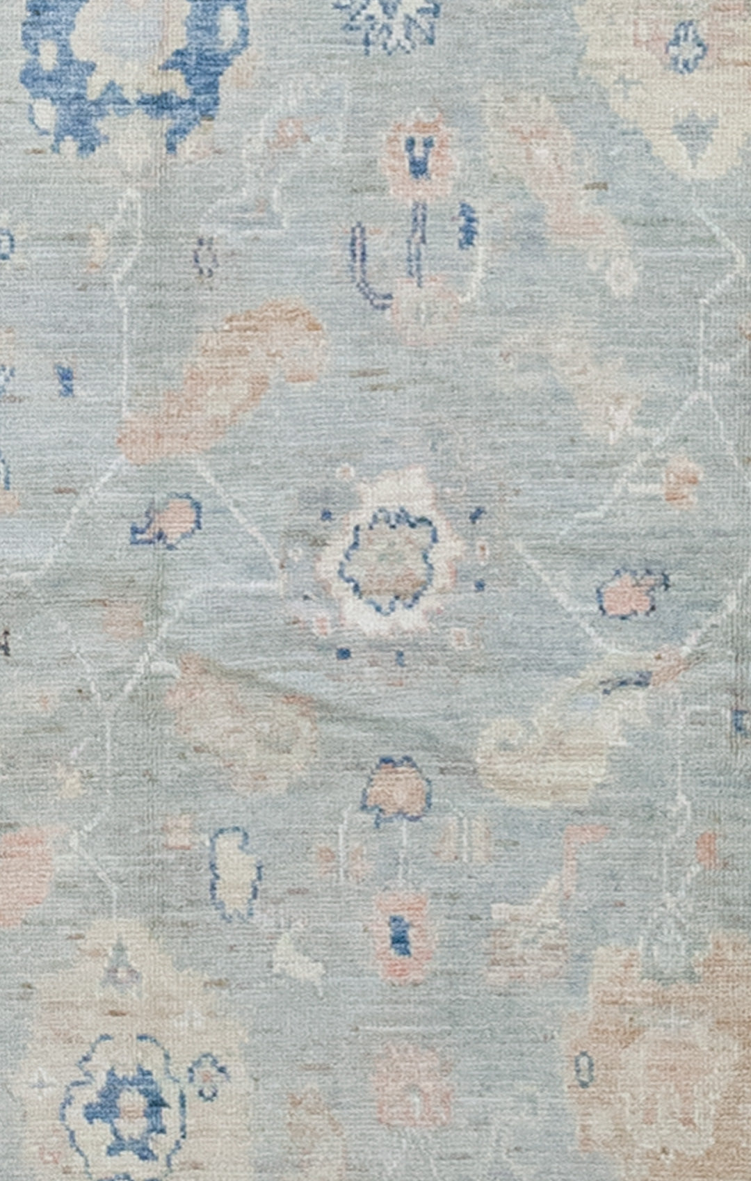 The center of the carpet features large colorful coral heads.