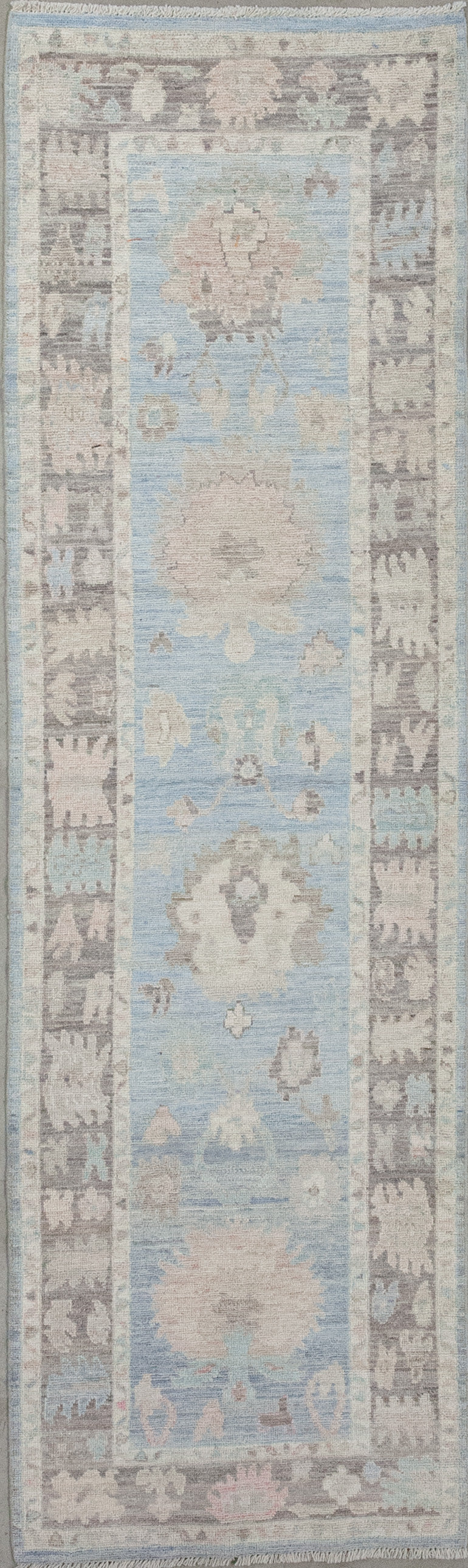 Hallway rug was woven with a cloudy tone for the background and an elegant brown frame.