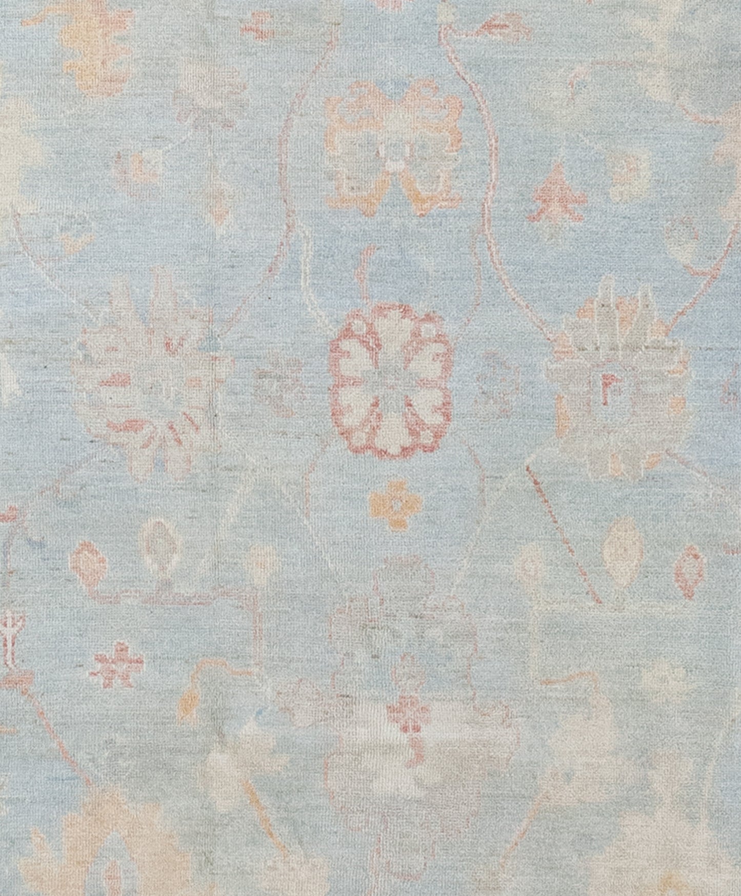 The center of the rug features large abstract sunflowers on a blue background.