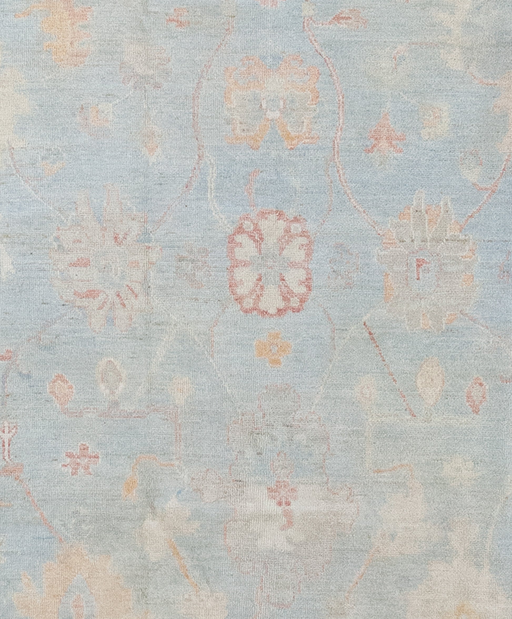 The center of the rug features large abstract sunflowers on a blue background.